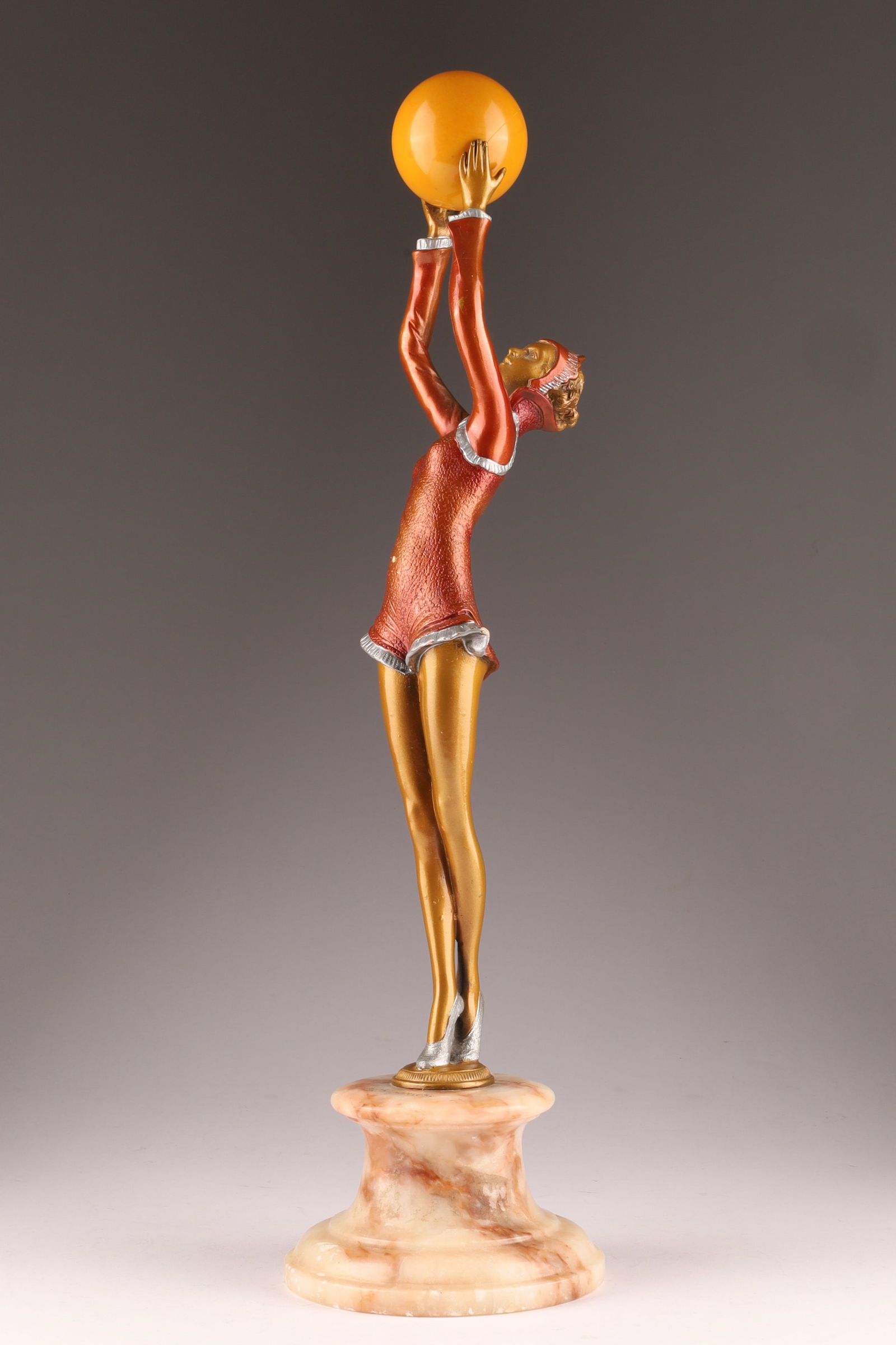 Demetre Chiparus (Romanian, 1886-1947) Art Deco Polychrome Bronze Sculpture, Ball Girl: Demetre Chiparus (Romanian, 1886-1947), Polychrome Bronze Sculpture, Ball Girl, on Onyx Base. Signed on base, D. Chiparus. Measures 15 inches H, 18 inches H with base. Small spots of loss to finish on