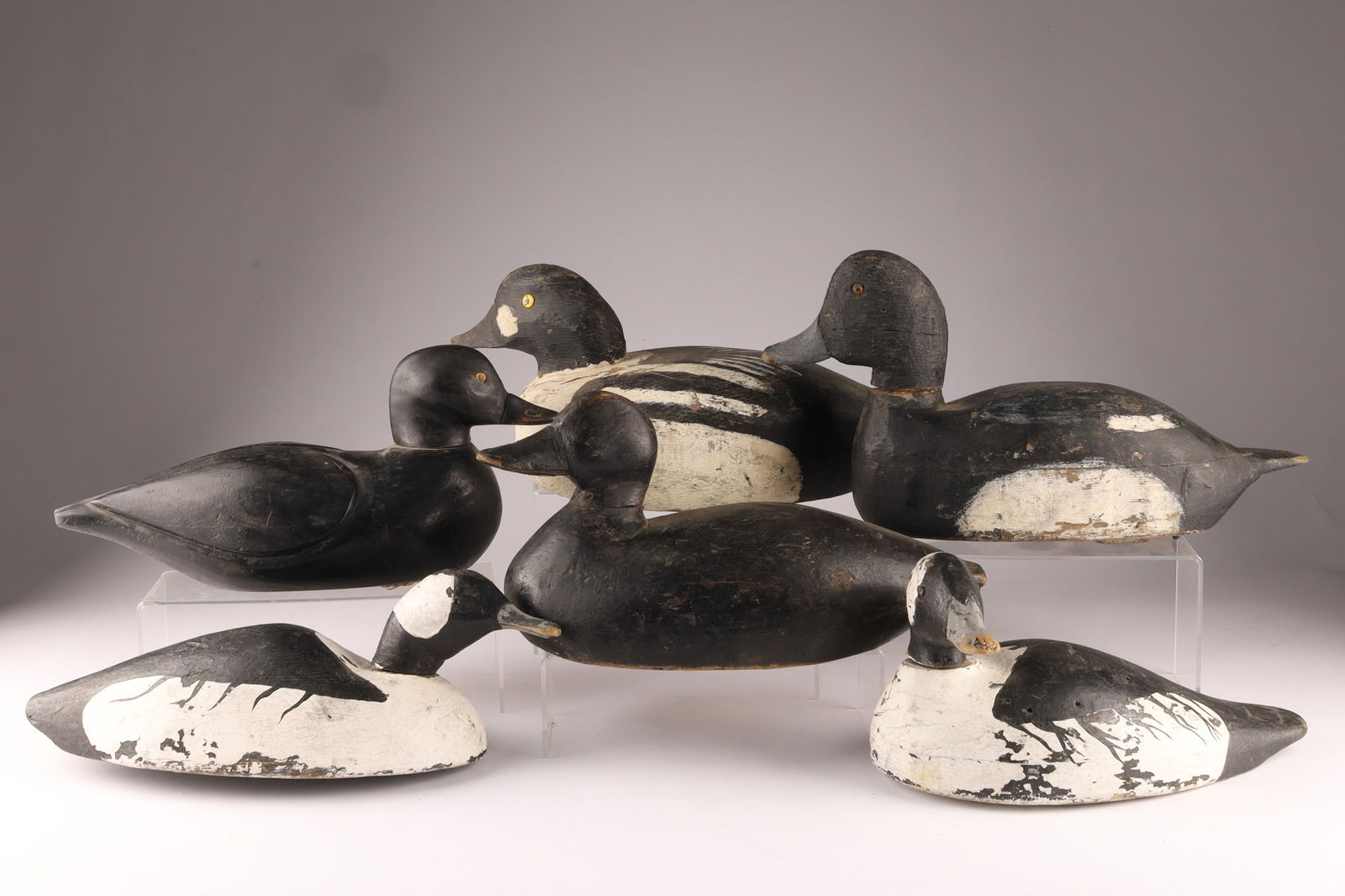 Lot of 6 Carved and Painted Duck Decoys: Lot of 6 Carved and Painted Duck Decoys. One signed J. Ball, largest measures 6.5 inches H x 16 W.