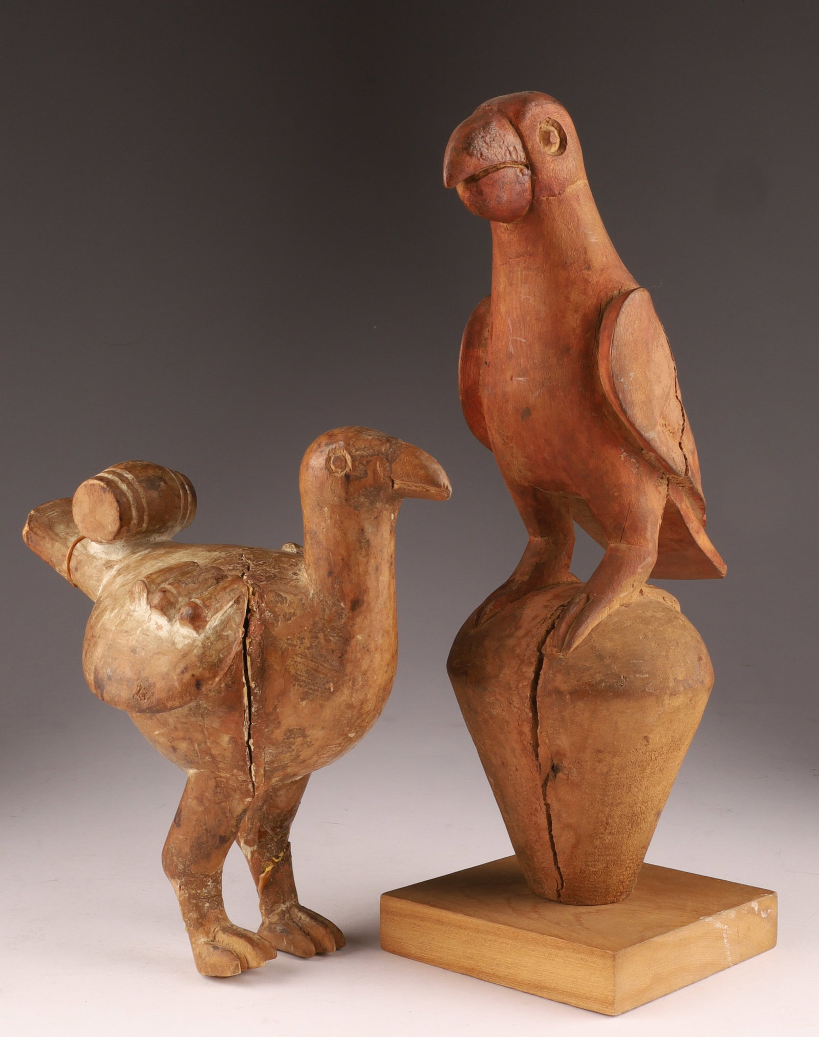Lot of Two Folk Art Carved Birds, Parrots: Lot of Two Folk Art Carved Birds, Parrots . Taller measures 11 inches H, smaller has some repairs, measures 7 inches H x 6 W.