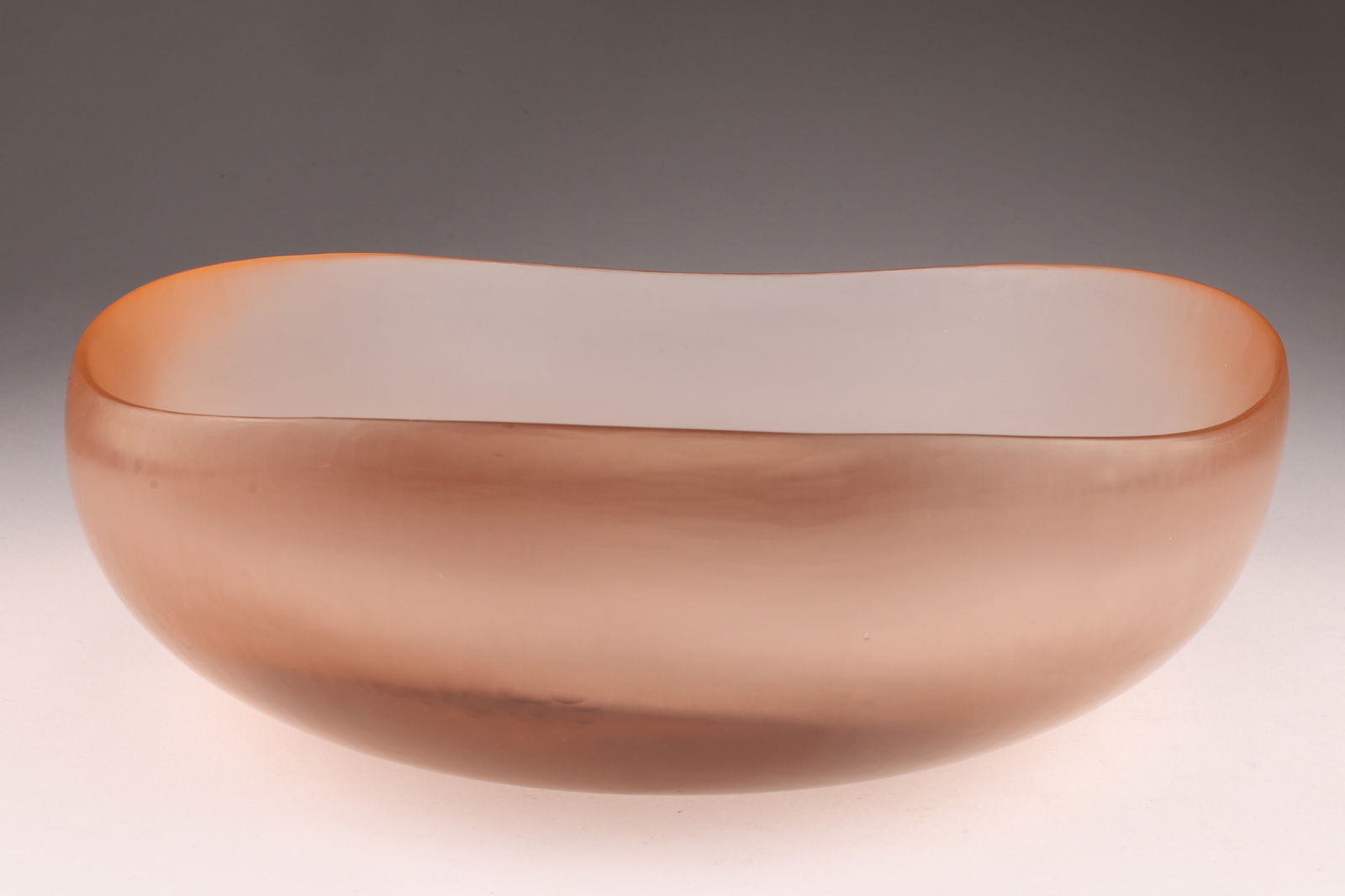 VENINI TOBIA SCARPA Murano Battuto Glass Bowl, Peach: Designed by Tobia Scarpa, this Venini bowl showcases the battuto technique, creating a beaten texture across the surface. Signed on underside. Measuring 9 inches diameter x 3 H. . From the collection