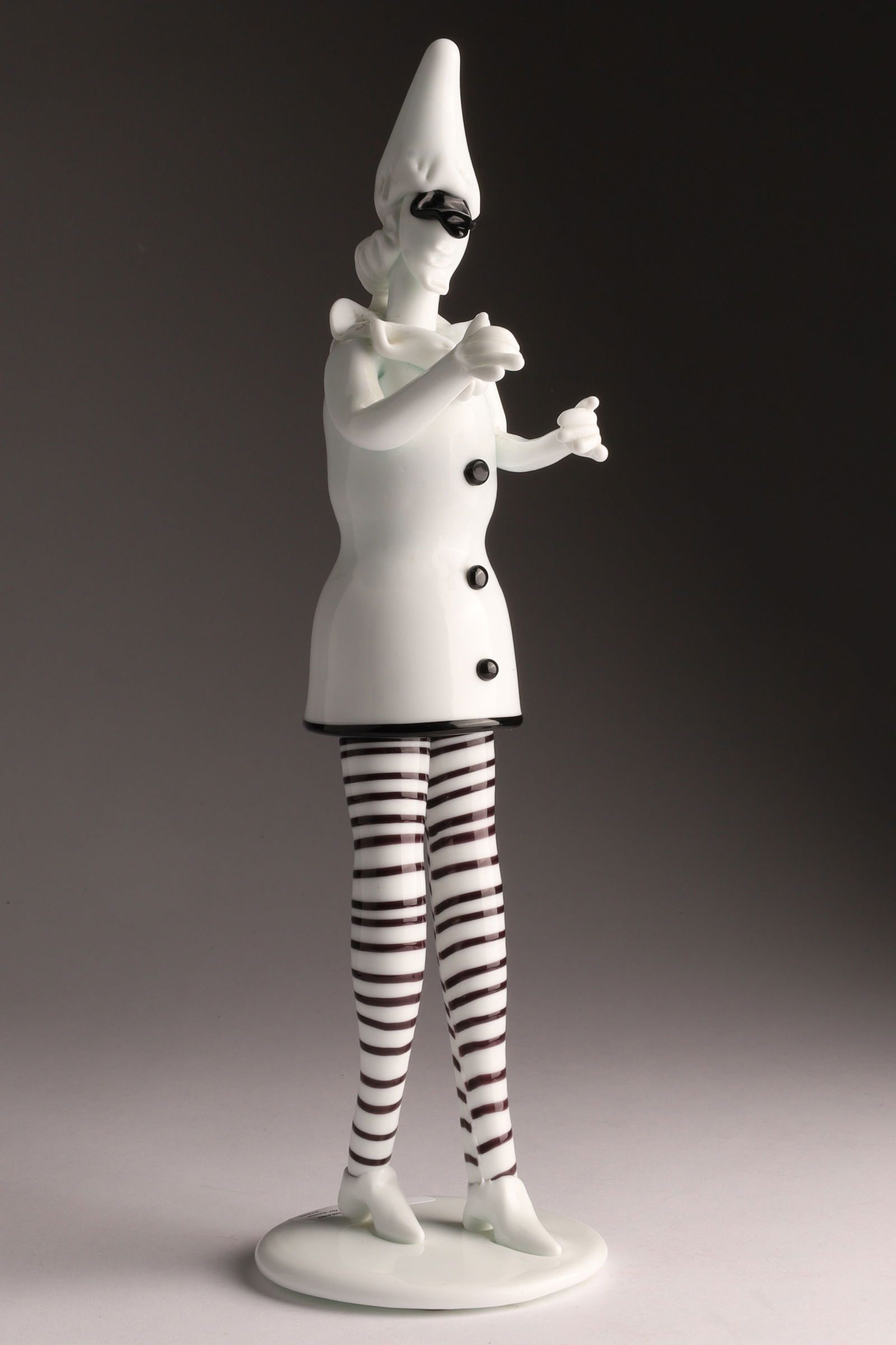 VENINI FULVIO BIANCONI Murano 'Tiepoleschi' Dancer Figurine: Designed by Fulvio Bianconi, this Venini ‘Tiepoleschi’ figure depicts a standing character or clown wearing a black mask. Measuring 13 inches H x 4 W. From the collection of a prominent glass coll