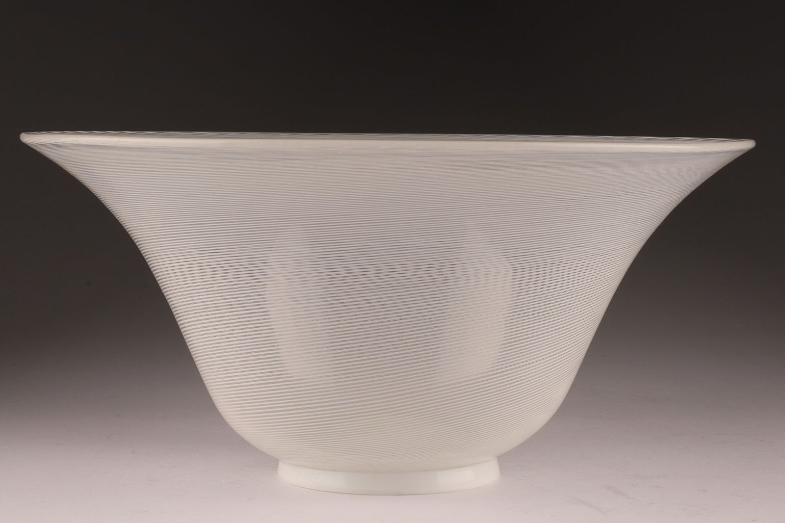 VENINI Murano Mezza Filigrana Glass Bowl, Opaque White: This Venini bowl is executed in the mezza filigrana technique. With original stickers and signed on foot, 1983. Measuring 8.75 inches diameter x 4 H. From the collection of a prominent glass