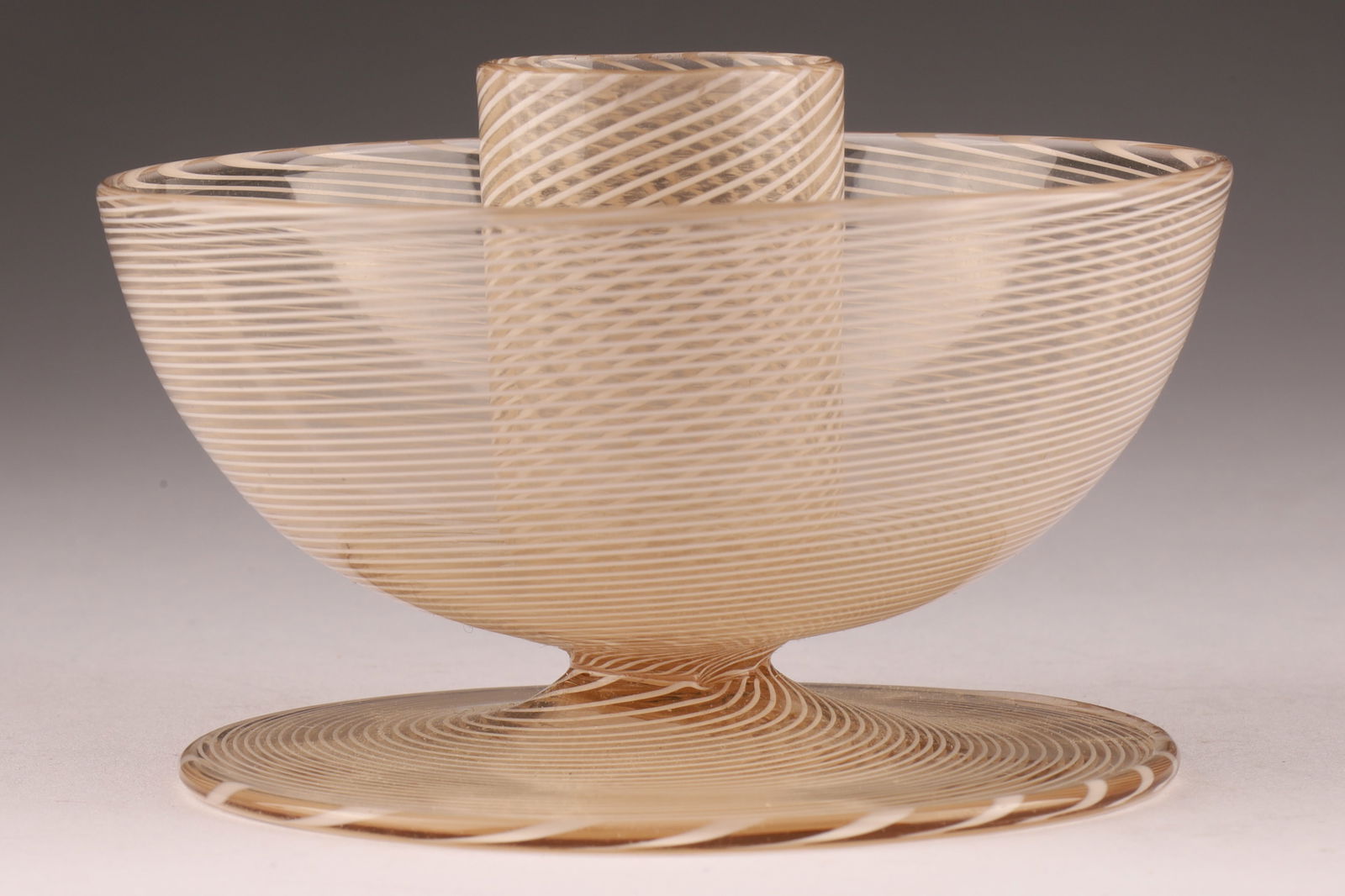 VENINI Murano Mezza Filigrana Candlestick: This Venini candlestick is crafted using the mezza filigrana technique. Measuring 3.75 inches W x 2.25 H. From the collection of a prominent glass collector from Toronto.