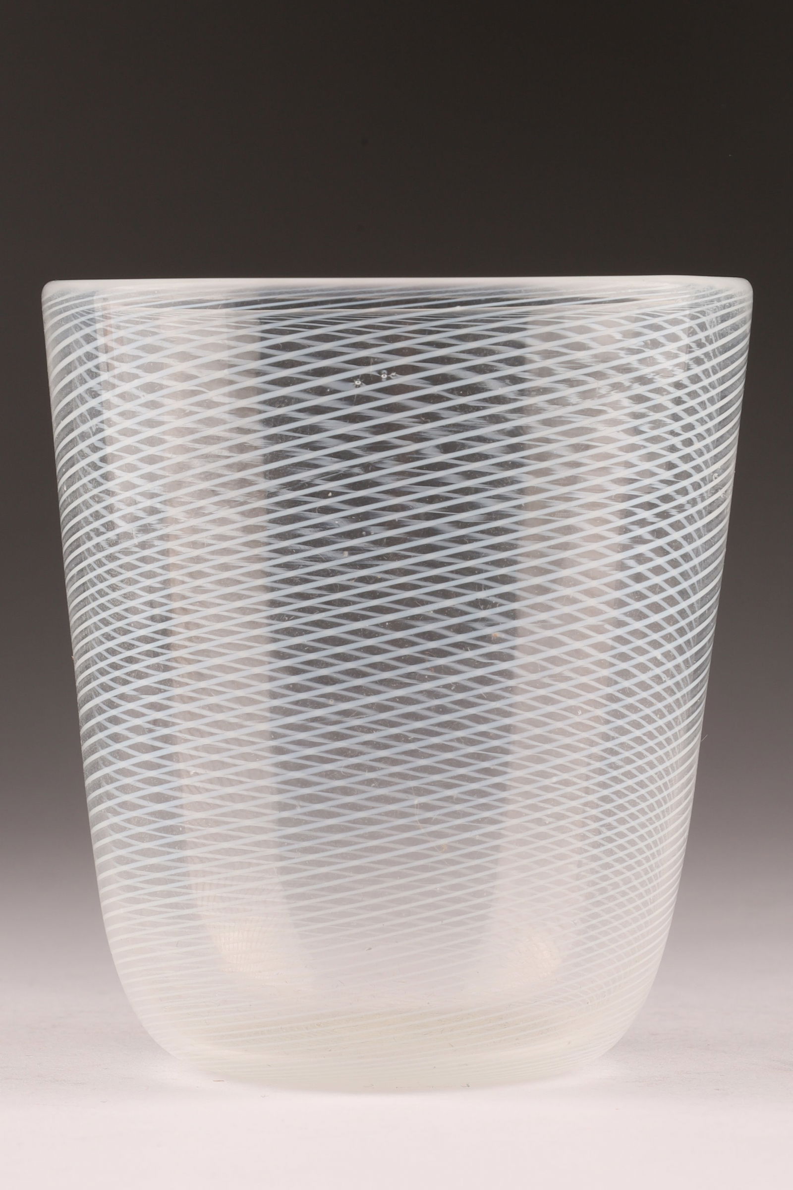 VENINI Murano Mezza Filigrana Glass Tumbler/Vase: This Venini tumbler showcases the mezza filigrana technique with delicate internal filigree lines. Measuring 3.75 inches H x 3 W. From the collection of a prominent glass collector from Toronto.