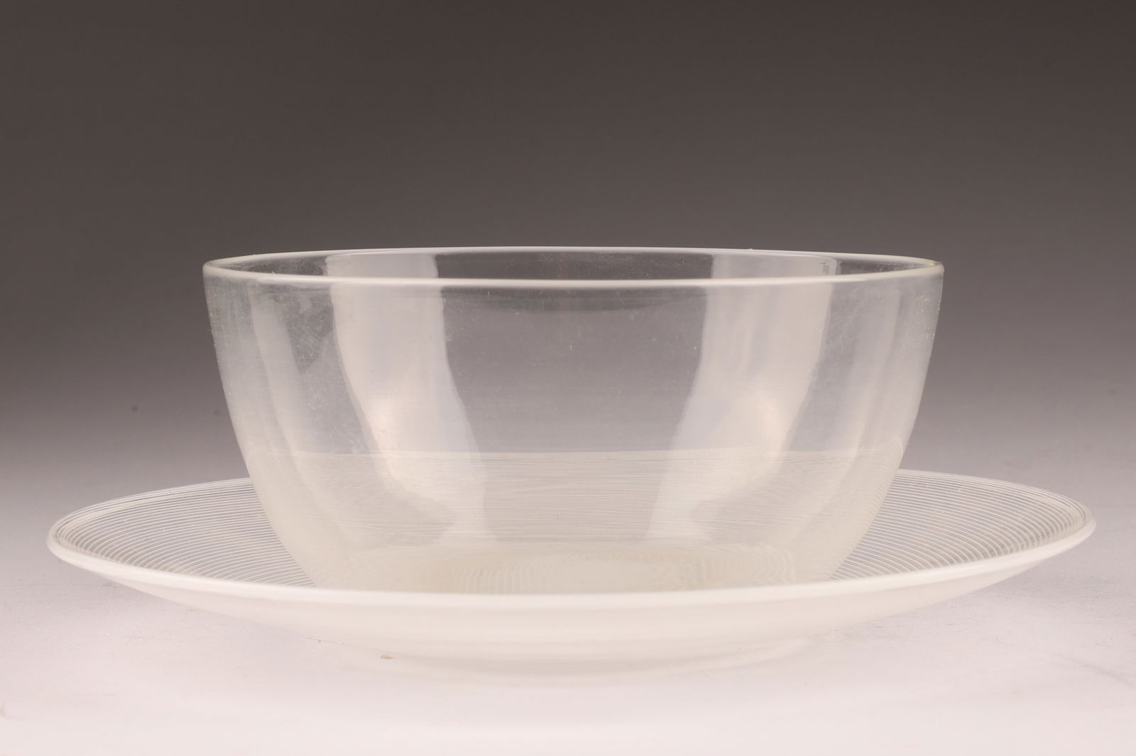 VENINI Murano Mezza Filigrana Dessert Set, Bowl & Saucer: This Venini set includes a bowl and saucer, both featuring the mezza filigrana technique. Saucer measures 5.5 inches diameter, bowl measures 4 inches W x 2 H. From the collection of a prominent glass