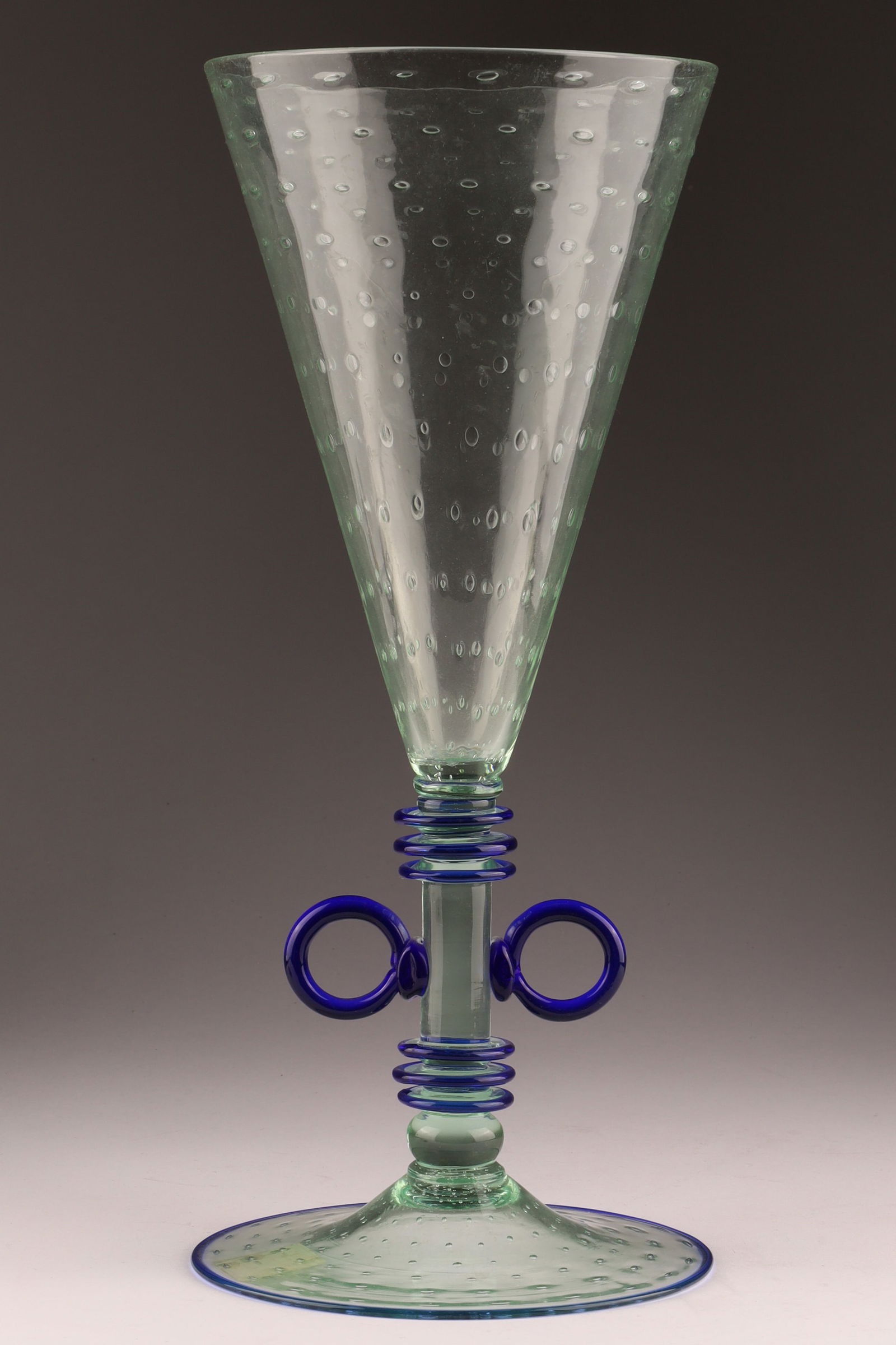 RARE VENETIAN UMBERTO BELLOTTO Art Glass Tall Flute Vase, Blue Coils: Designed by Umberto Bellotto (1925-1928), this vase takes the form of a tall, slender champagne flute with controlled bubble pattern and cobalt blue applied decoration. Measuring 12.5 inches H x 5 W,