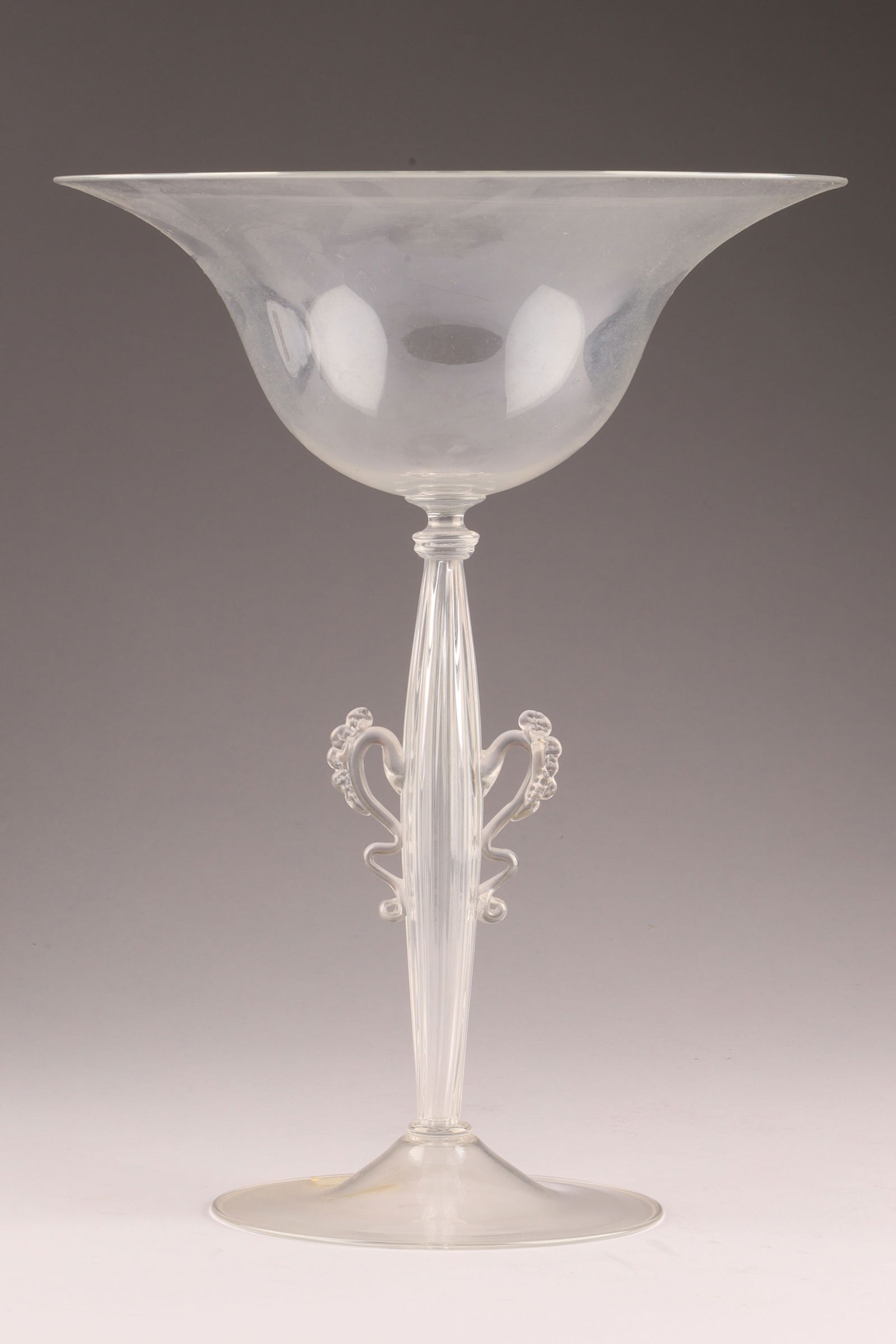 VENETIAN Attributed UMBERTO BELLOTTO Stemmed Tazza: Attributed to Umberto Bellotto (1925-1928), this tazza features a clear, stemmed form. Measuring 10 inches H x 8 W. From the collection of a prominent glass collector from Toronto.