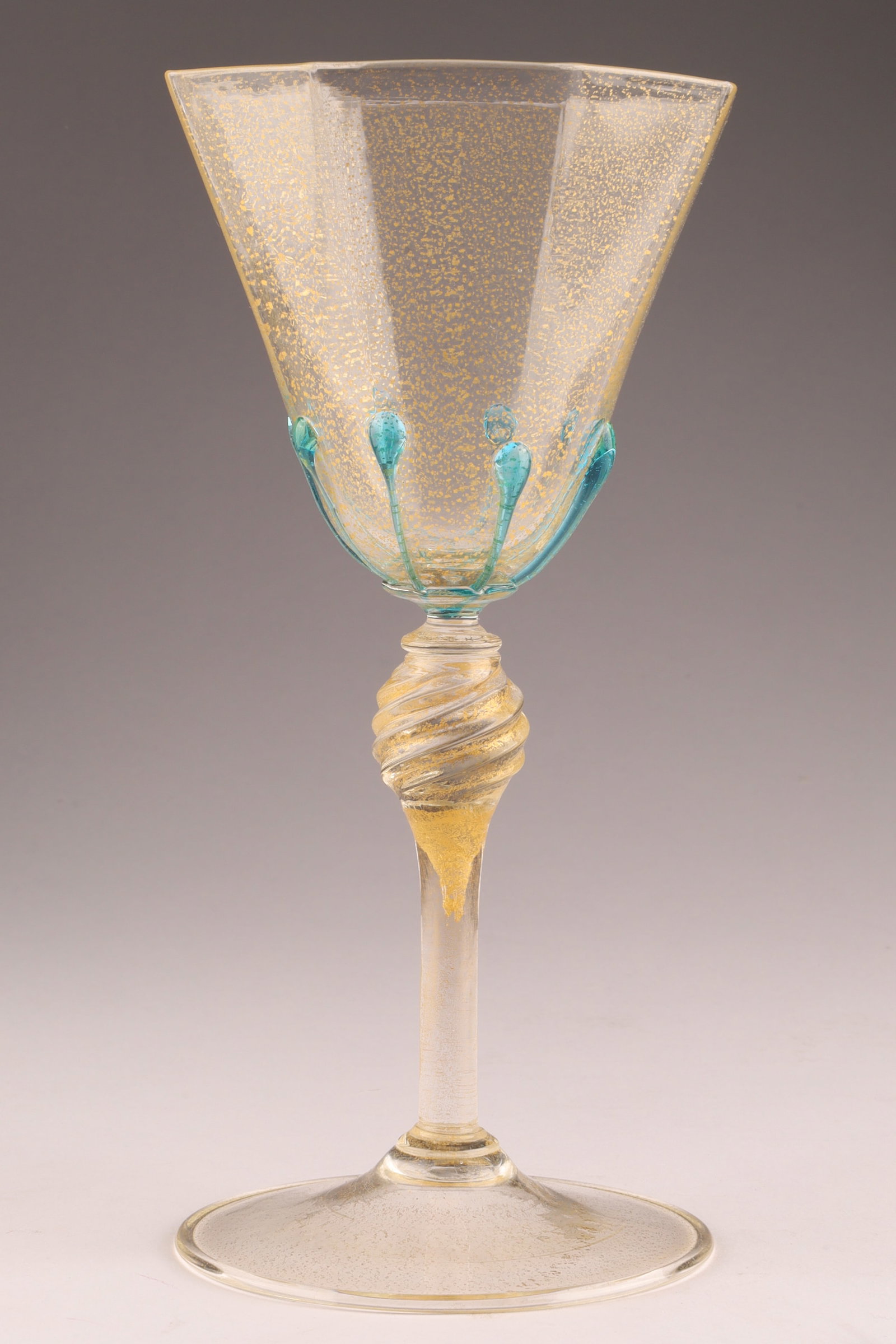 SALVIATI Attributed Venetian Glass Wine Goblet, Dot Decor: Attributed to Salviati, this Venetian wine glass dates to circa 1900. With gold flecks and applied blue decoration, this glass measures 7 inches H x 3 W. From the collection of a prominent glass