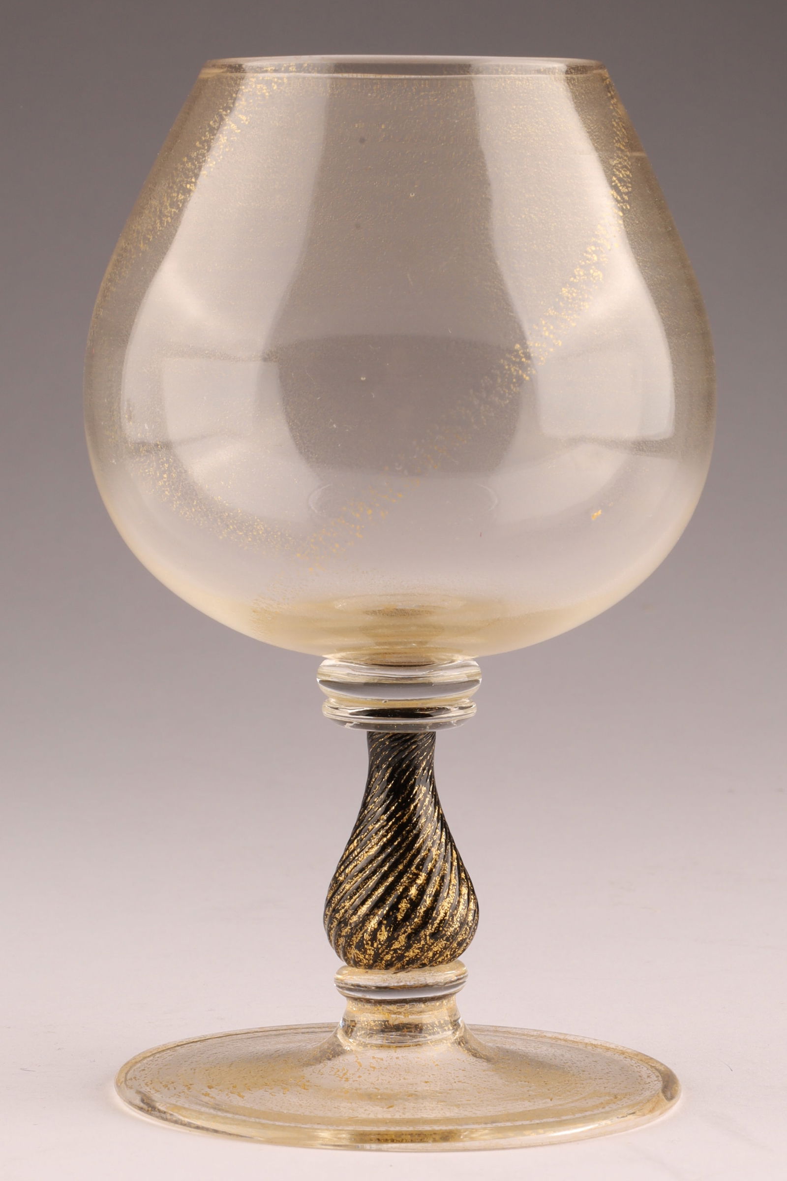 VINTAGE Venetian Art Glass Brandy Snifter, Gold fleck with Black Knop: This Venetian wine glass, dating to circa 1920, is designed as a brandy snifter or balloon glass. Measuring 5.5 inches H x 3W. From the collection of a prominent glass collector from Toronto.