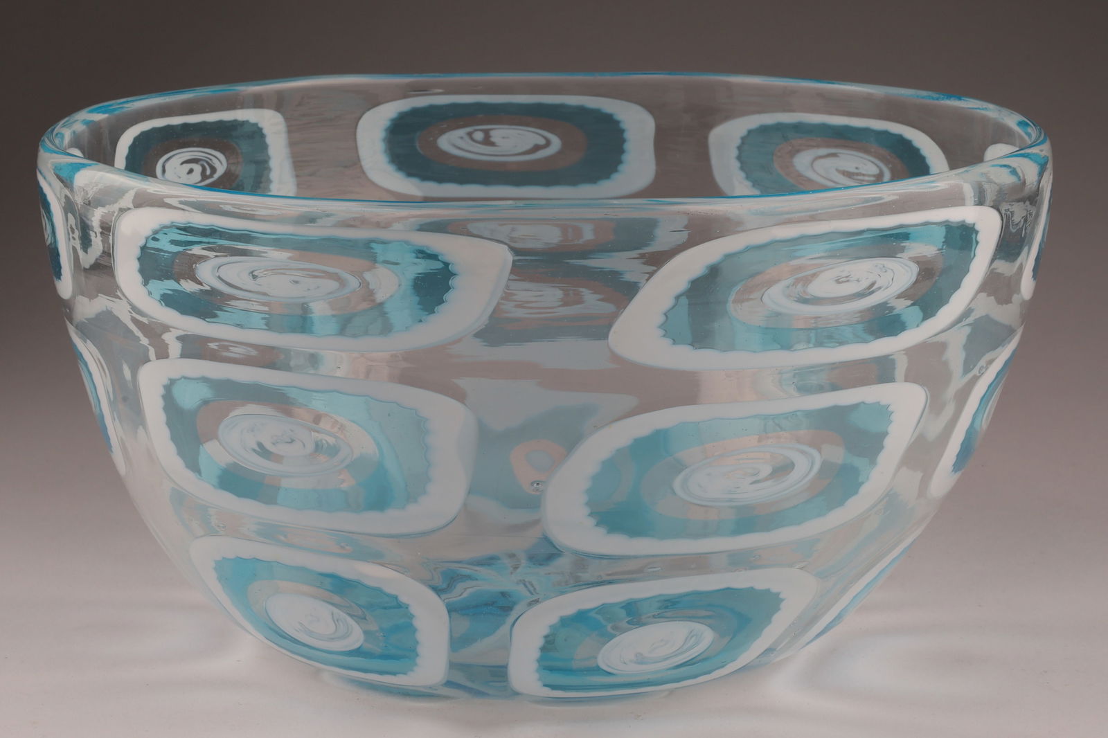 BAROVIER & TOSO Murano Dorico Art Glass Bowl, Blue/White: This Barovier & Toso bowl dates to the 1950s and displays the dorico technique, decorated with large blue and white murrines. Measuring 8 inches diameter x 4.25H. From the collection of a prominen