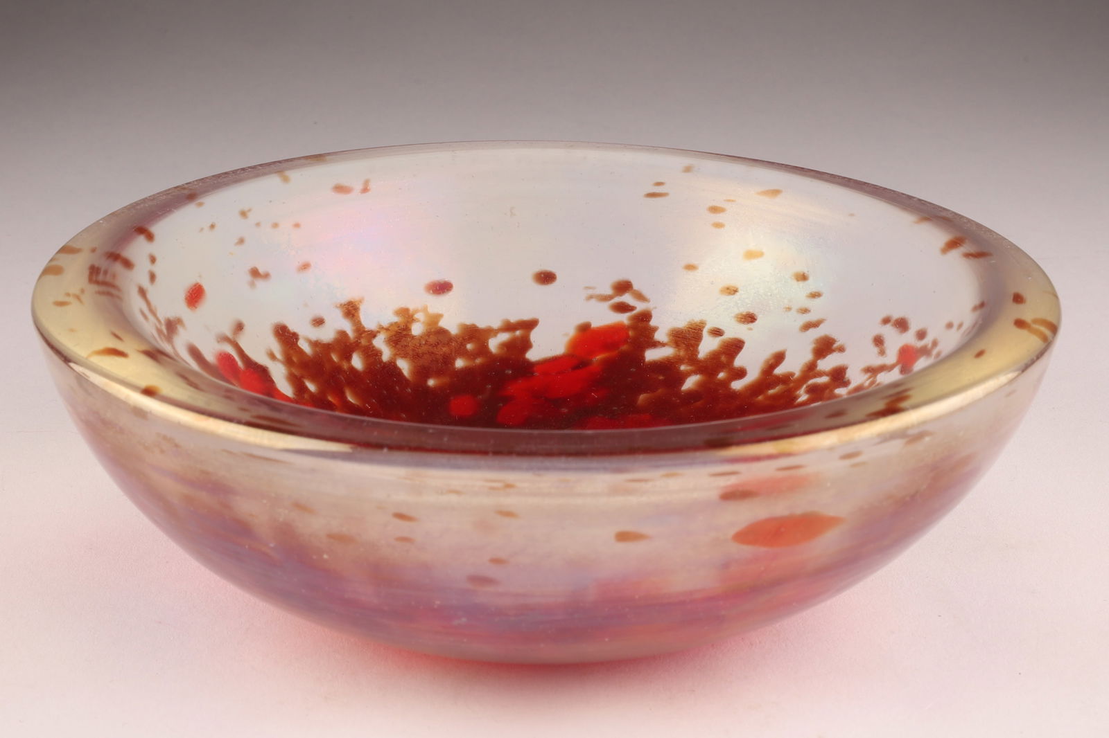 DINO MARTENS AURELIANO TOSO Murano 'A Mace' Bowl, Red/Gold Inclusions: Designed by Dino Martens for Aureliano Toso in the 1950s, this bowl features the 'a mace' technique with an iridescent finish, measuring 6 inches W x 2 H, old paper label on underside. From the collec