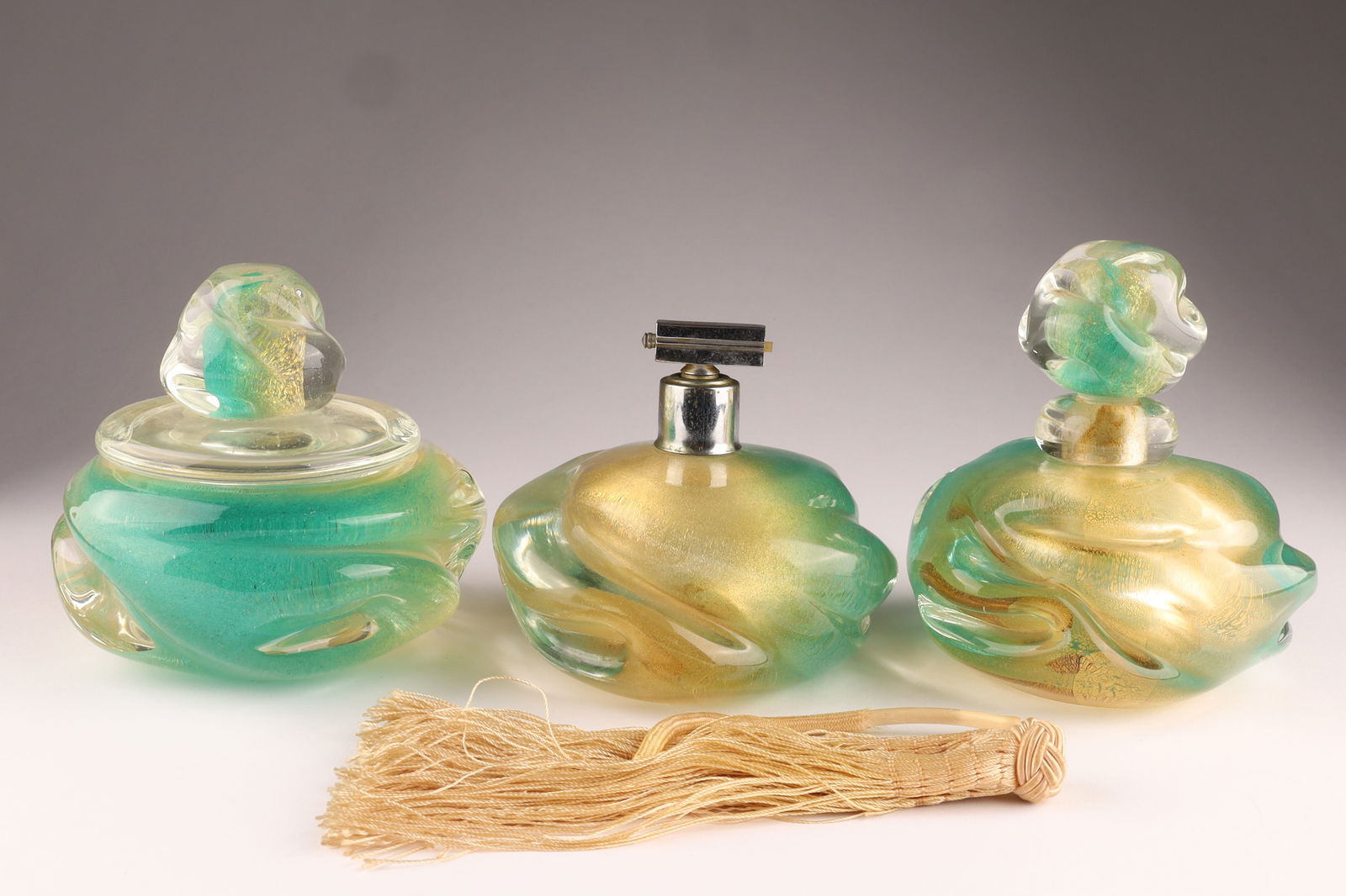 ARCHIMEDES SEGUSO Murano 'Polveri' Perfume Bottles, Set of Three: This Archimedes Seguso ‘polveri’ perfume set dates to 1954. All measuring 5.5 inches W x 4.5 H. From the collection of a prominent glass collector from Toronto.