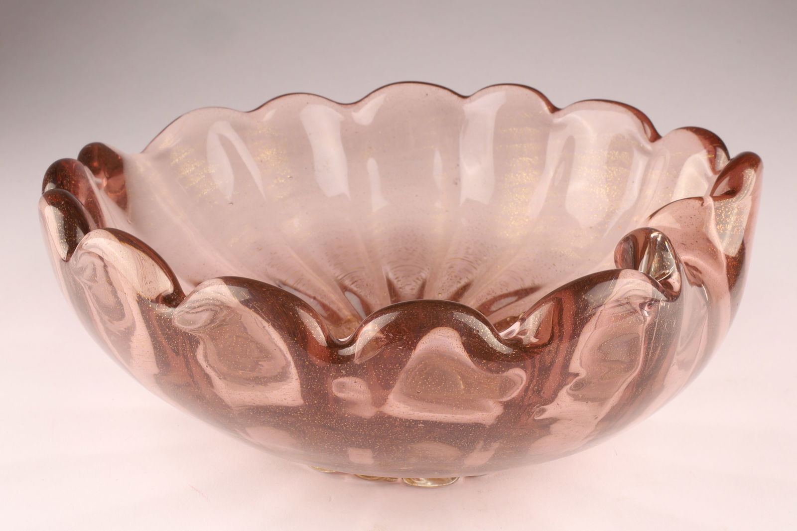 BAROVIER Attributed Murano Ruffled Art Glass Bowl, Pink with Gold Flecks: Attributed to Barovier in the 1950s, this bowl features a low, ruffled form. 8 inches W x 3 H. From the collection of a prominent glass collector from Toronto.