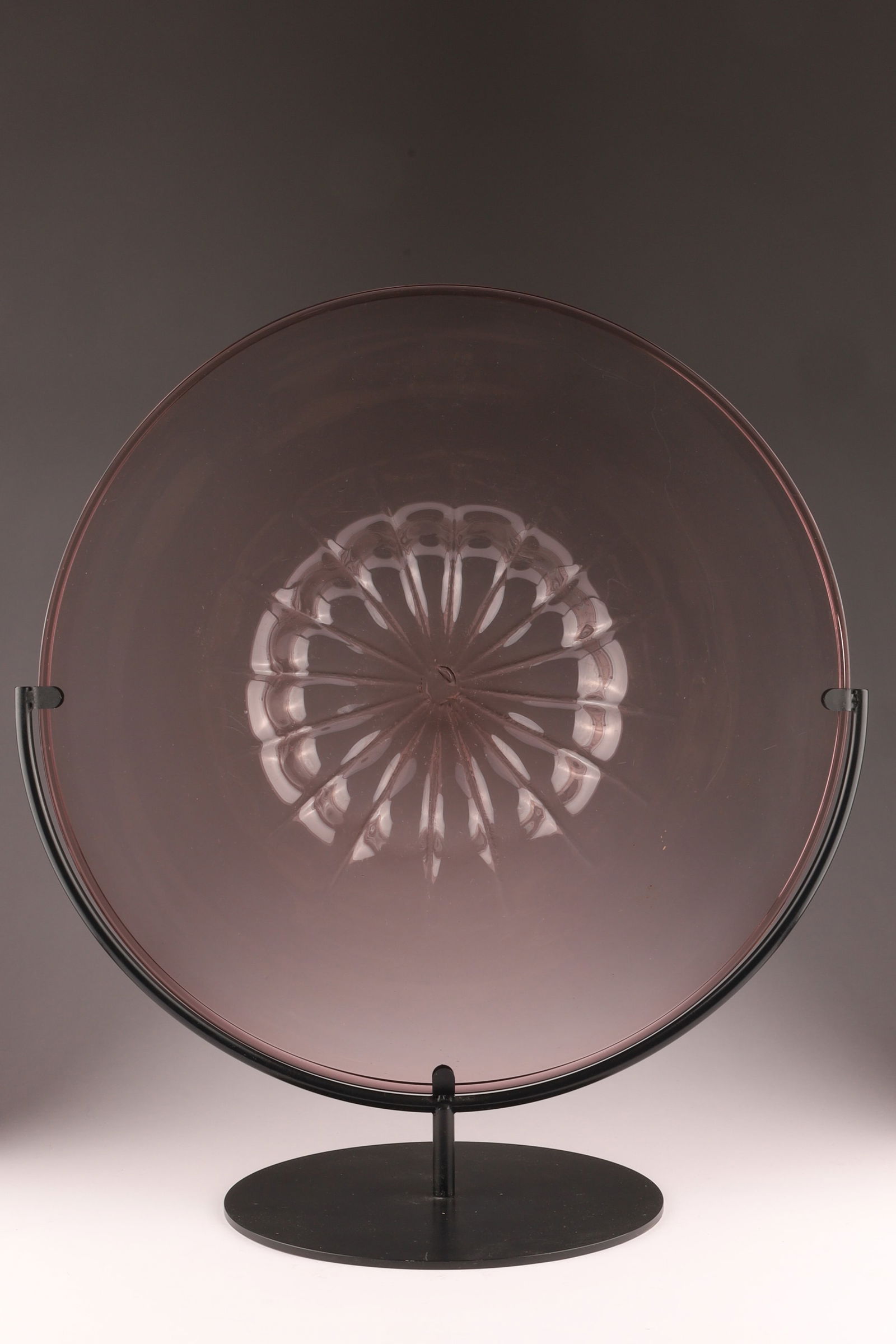 EARLY C.V.M. Murano Art Glass Large Plate / Rondelle, Pink: This large plate or rondelle by C.V.M. dates to circa 1920. Measuring 18.25 inches diameter, 21.25 inches H on black, metal stand. From the collection of a prominent glass collector from Toronto.