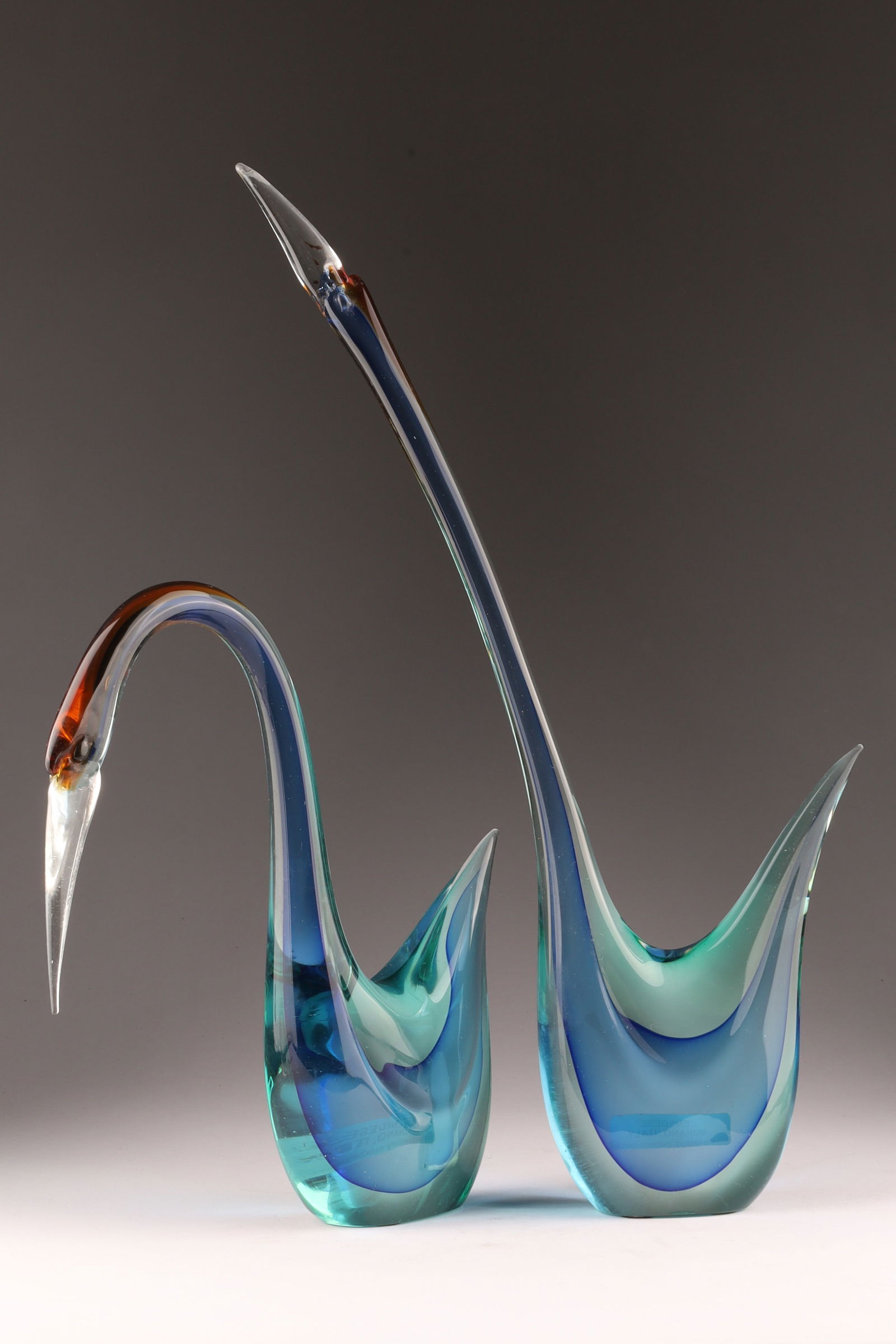 PAIR CENEDESE MURANO Blue SOMMERSO ART GLASS BIRDS 1960s: A large Mid Century pair of Cenedese Murano blue art glass birds from the 1960s, featuring a striking blue color achieved through the Sommerso layering technique. Measuring 16.5 inches H, 11 inches H.