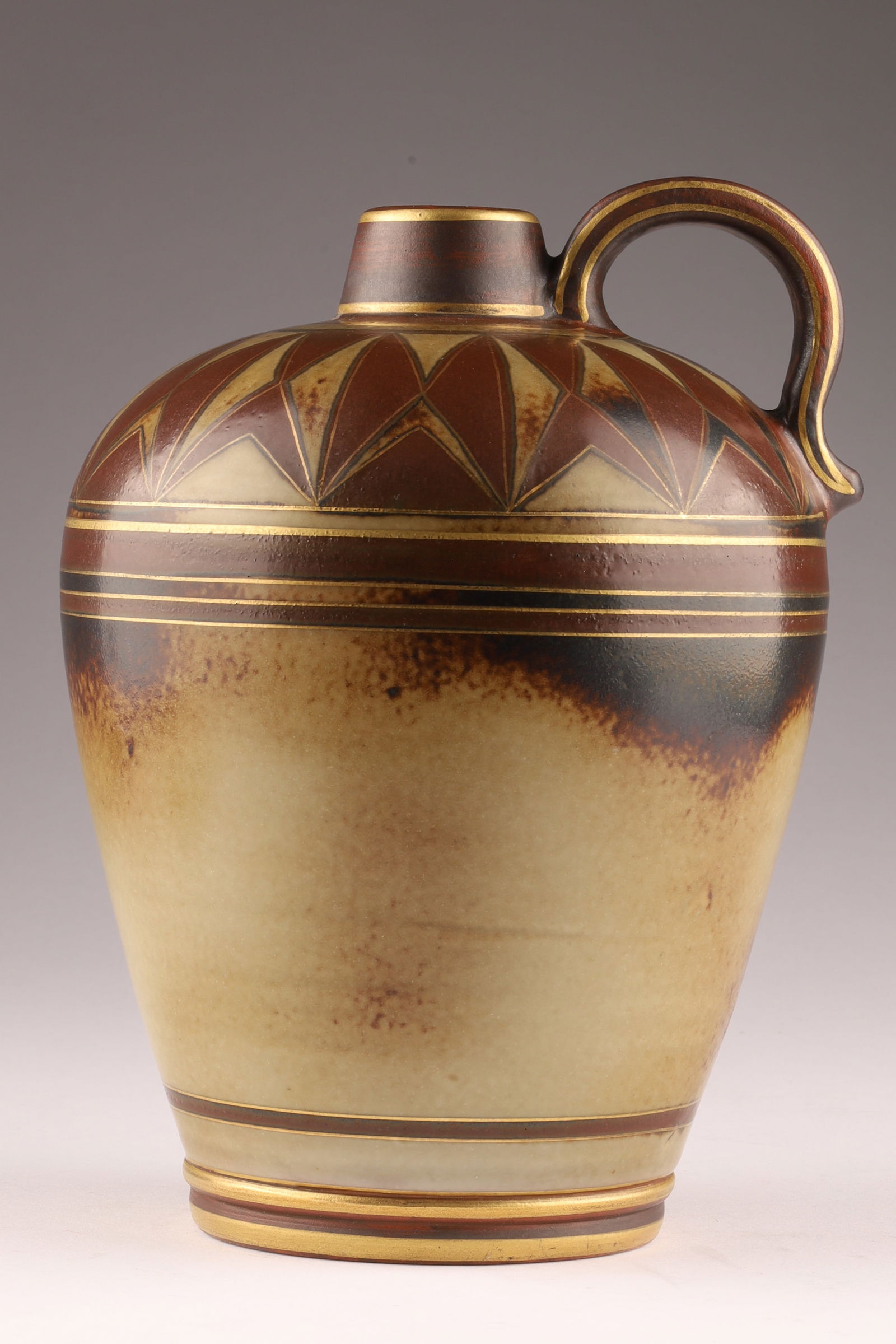 Gunnar Nylund Rorstrand Flambe Stoneware Jug Art Deco Ewer c. 1930s: A stoneware jug featuring the rich, warm-toned Flambe glaze, a signature of the collection developed by Gunnar Nylund for the Rorstrand factory in the 1930s. This piece has a classic Art Deco