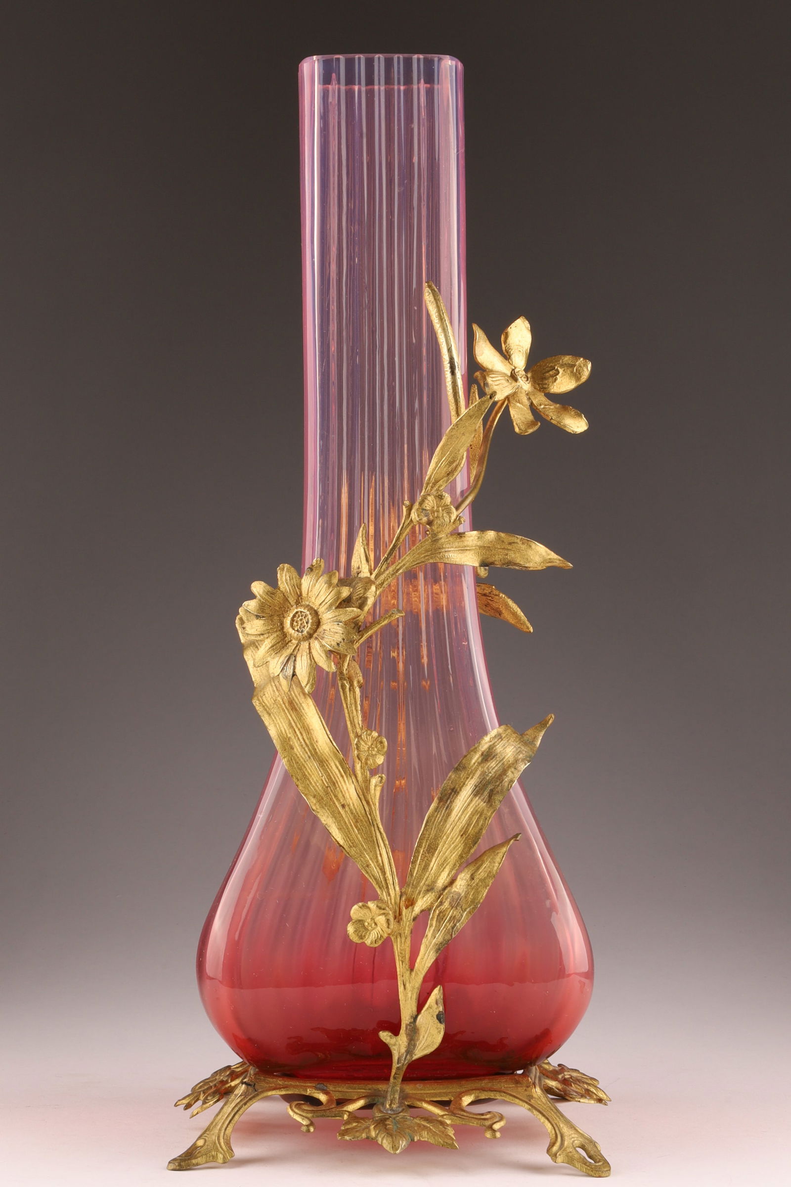 Antique French Art Nouveau Opalescent Pink Ormolu Mounted Vase: Antique French Art Nouveau Ormolu Mounted Opalescent Pink Ribbed Vase. A fine blown glass pink ribbed vase in floral decorated gilt mount, measuring 15 inches H x 6 W.