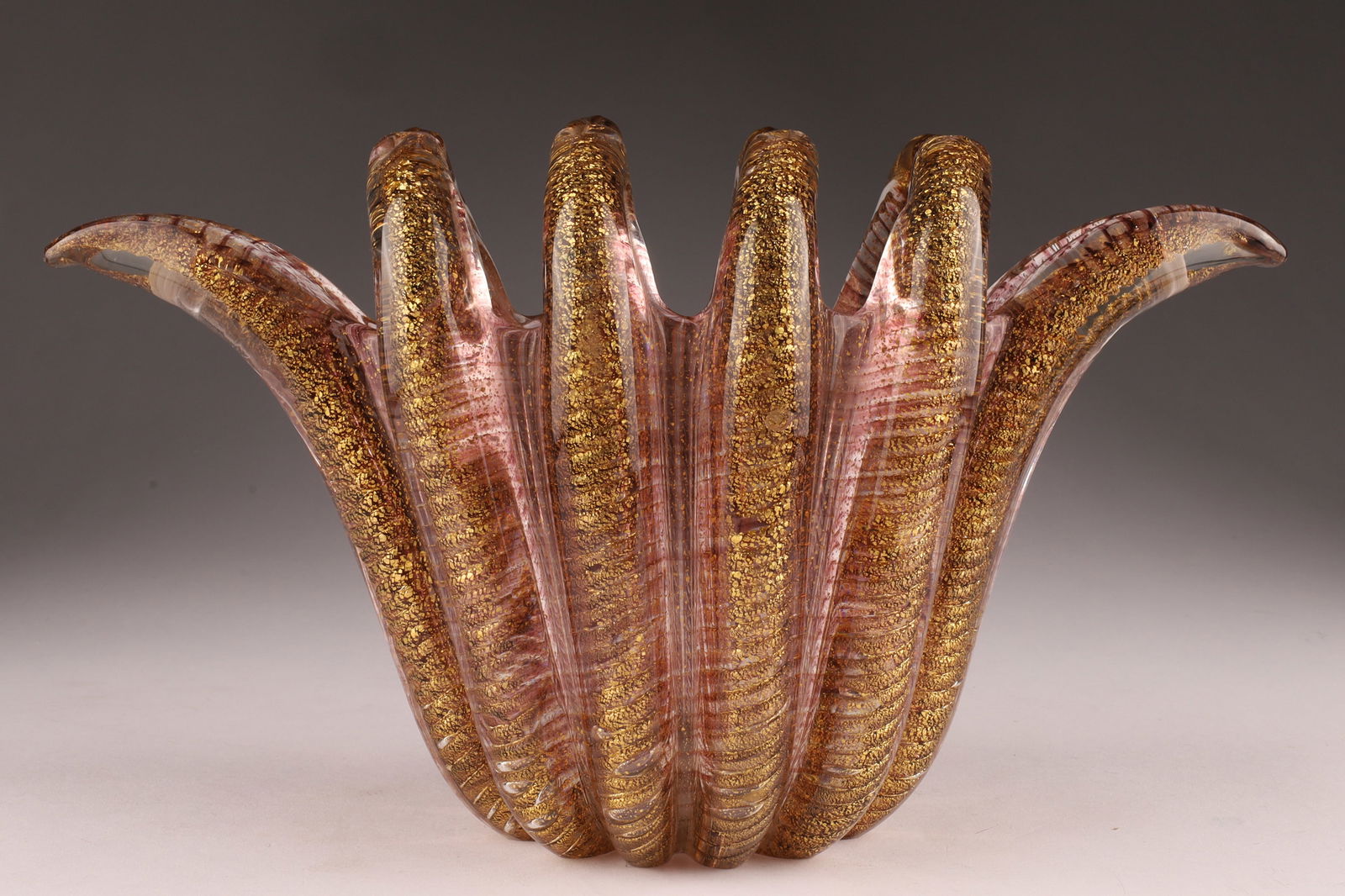 Ercole Barovier (1889-1974) for Barovier and Toso Cordonato Oro Gold Flecks Finger Vase: Ercole Barovier (1889-1974) for Barovier and Toso Cordonato Oro Gold Flecks over Purple Stripes Finger Vase. Measuring 10 inches L x 5.5 H x 4 deep.