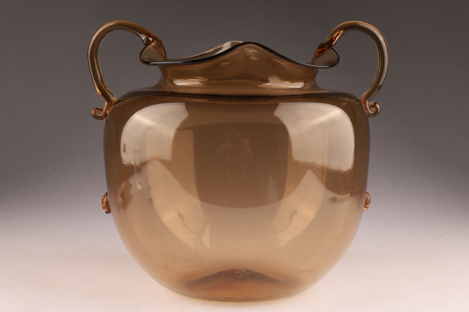 Vittorio Zecchin (1878-1947) Soffiato Round Vase in Brown Glass with Double Handles: Vittorio Zecchin (1878-1947) Soffiato Round Vase in Brown Glass with wavy edge, double handles and applied prunts. With original paper sticker on underside, Venezia Murano 17624. 7 inches H x 8 W.