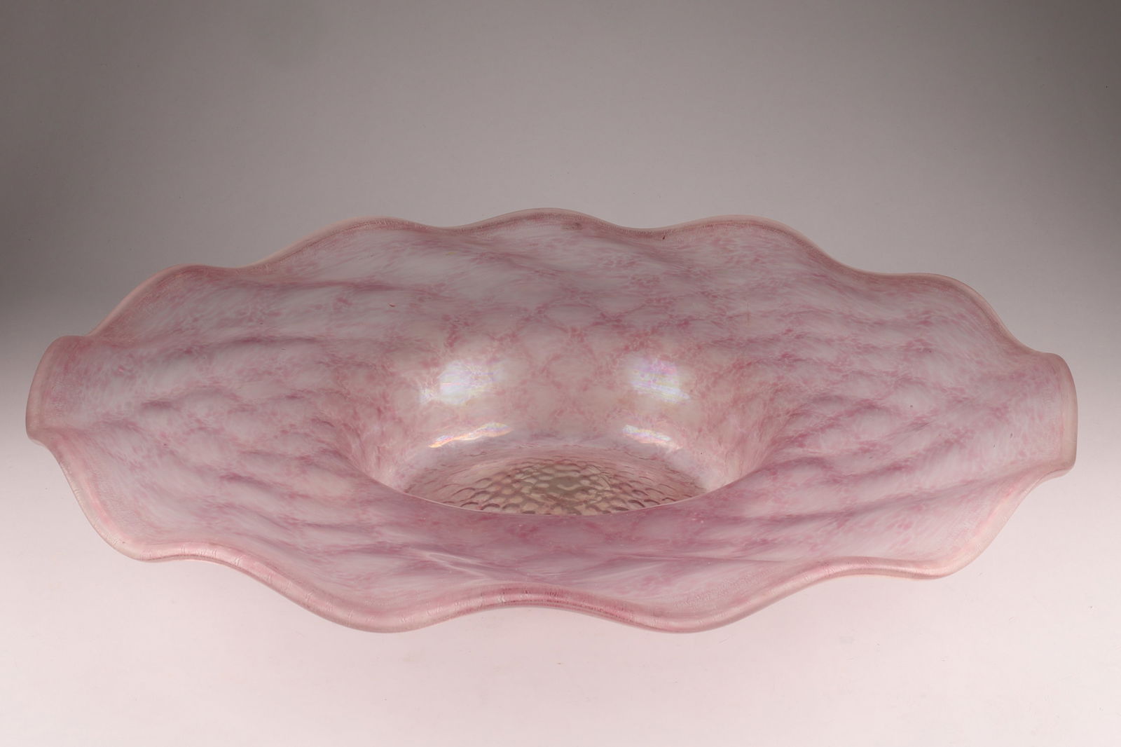 Attributed to Barovier and Toso Vagrant Centrepiece Plate in Pink Glass: Attributed to Barovier and Toso Vagrant Centrepiece Plate in Pink Glass, a deep basin with a comb pattern with wide, wavy edge and turned rim. Measuring 19 inches W x 3.25 H.