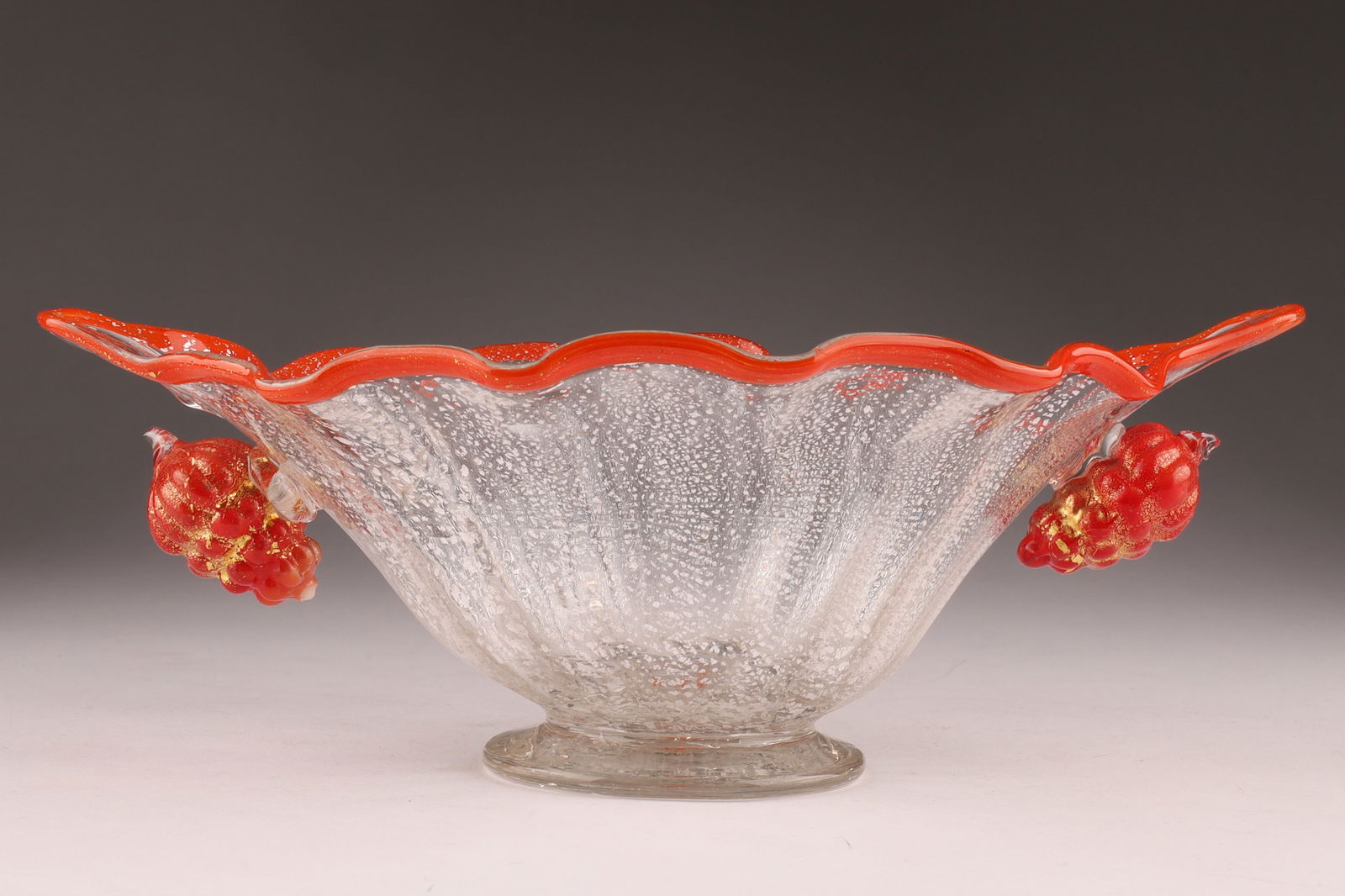 Attr Fratelli Toso Vetreria Transparent and Red Glass Bowl with Silver Leaf Inclusions: Attributed to Fratelli Toso Vetreria Transparent and Red Glass Bowl with Silver Leaf Inclusions. Cracks within glass near one grape cluster. 10 inches W x 6 deep x 3.5 H.