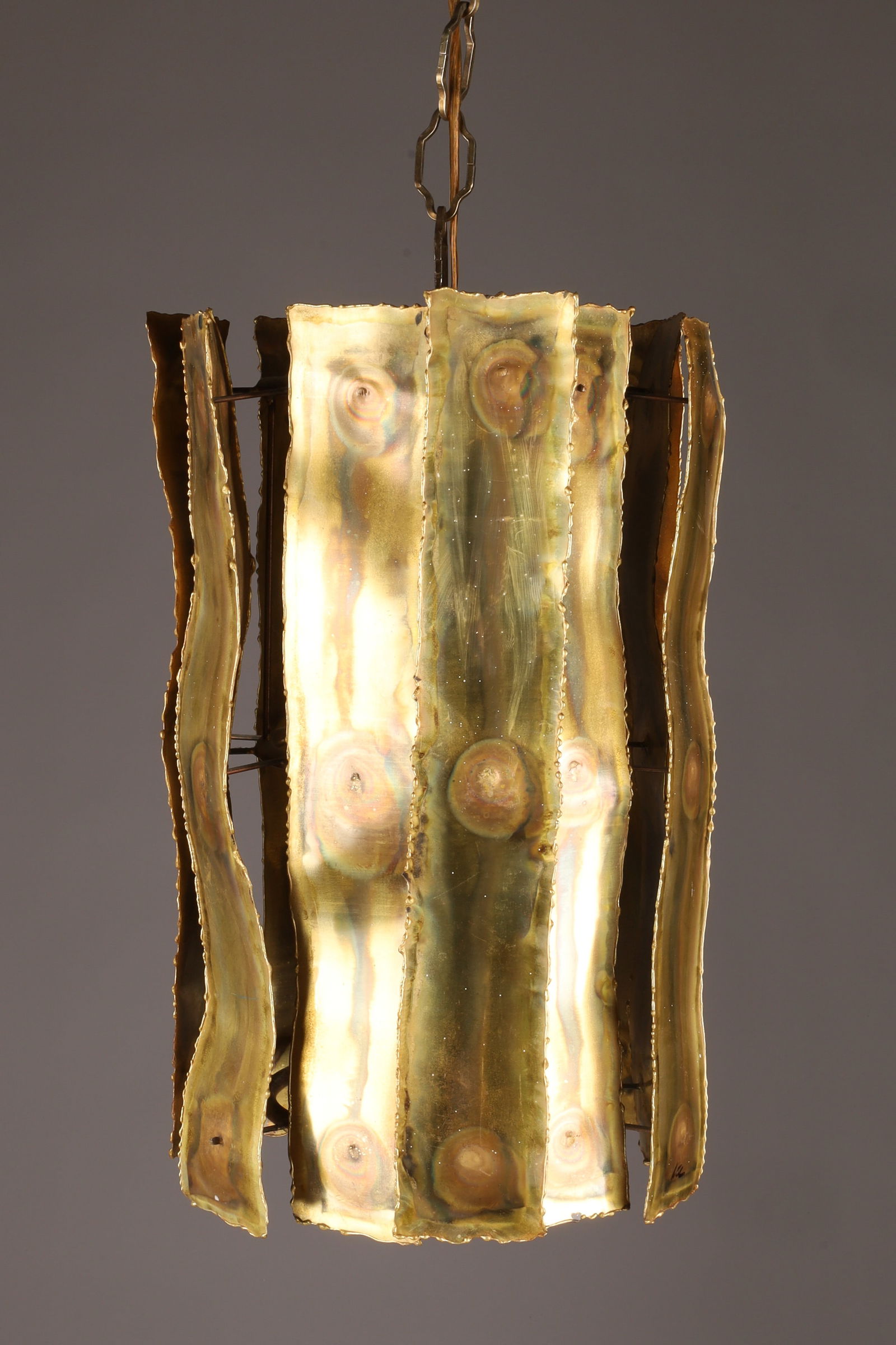 Mid Century Brutalist Torched Brass Chandelier Hanging Fixture: Mid Century Brutalist Torched Brass Chandelier Hanging Fixture. Measuring 15 inches H x 10 W, with chain measures 25 inches.