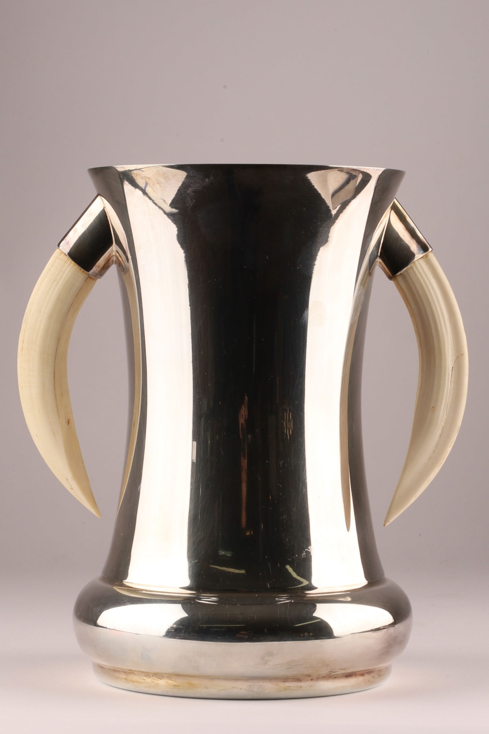 Art Deco Silver Plated Boar's Tooth Two Handled Loving Cup or Stein: Silver plated two-handled loving cup or hunting stein with boar tusk handles, Art Deco period. Measuring 8.5 inches H x 7.5 W.