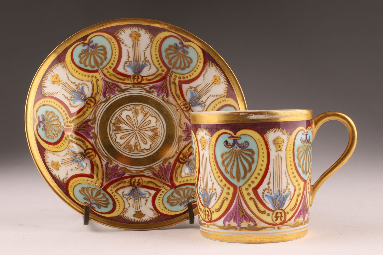 Antique Sevres Coffee Can / Gobelet Litron and Saucer C. 1810: Antique Sevres Coffee Can / Gobelet Litron and Saucer C. 1810. Decorated with palmettes, large heart-shaped motifs, shell patterns, and ornamental friezes. Mark on the base of this porcelain item is a