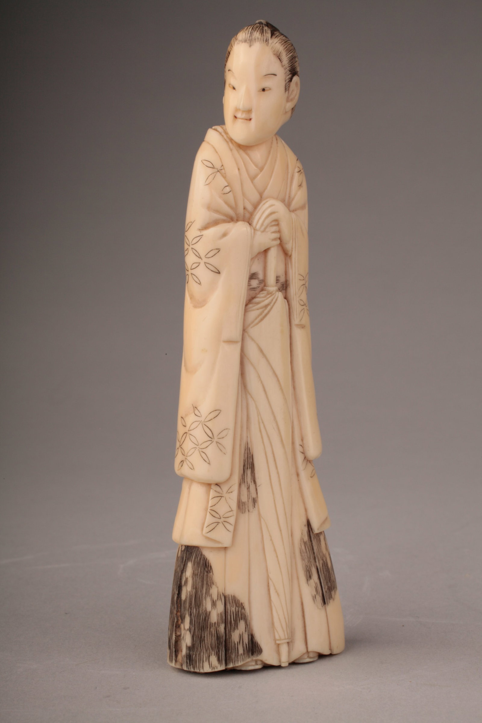 A Carved Japanese Okimono of a Geisha (1 of 8)