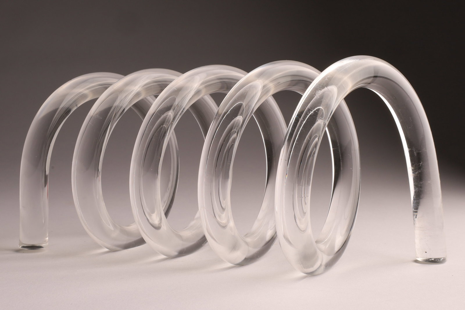 Mid-Century 1970s Op Art Dorothy Thorpe Lucite Letter Holder: Mid-Century Modern Dorothy Thorpe Lucite Spiral Letter Holder designed by American artist Dorothy Thorpe, known for her mid-century modern style. The item is made of clear, thick Lucite formed i