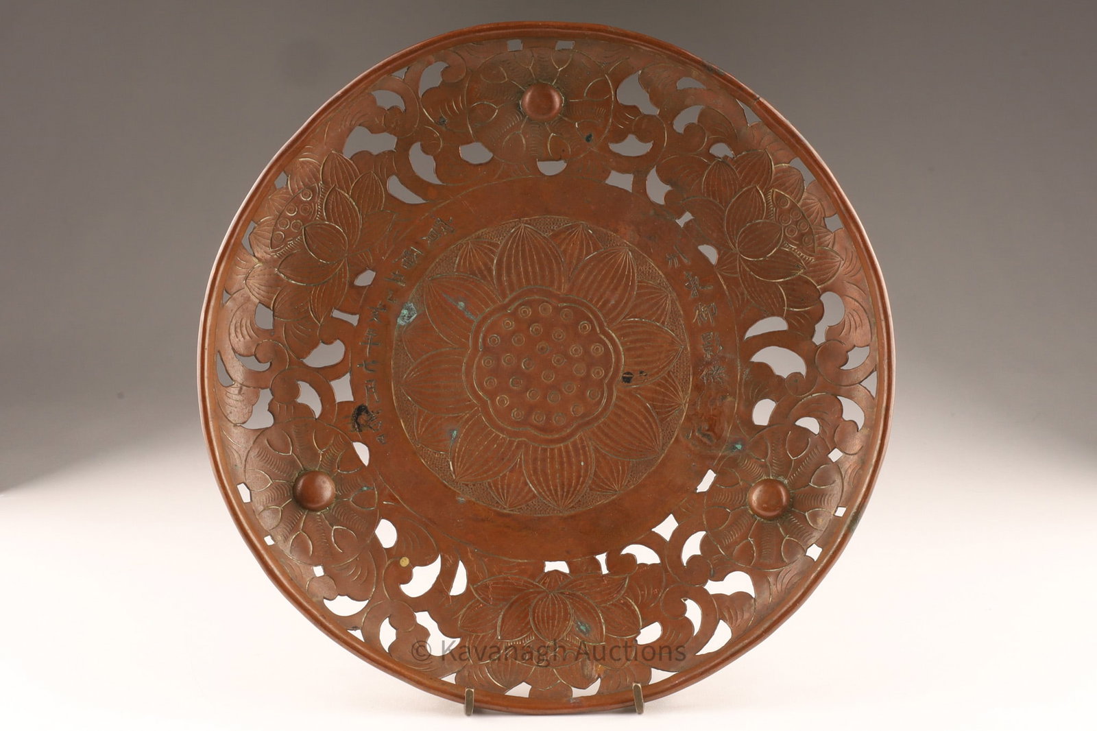 Japanese Bronze Buddhist Offering Tray, Inscribed Horeki 9 (1759): Japanese circular bronze Buddhist offering tray featuring pierced lotus-scroll border and a finely chased central lotus medallion. The inner band bears a hand-incised dedicatory inscription reading ��