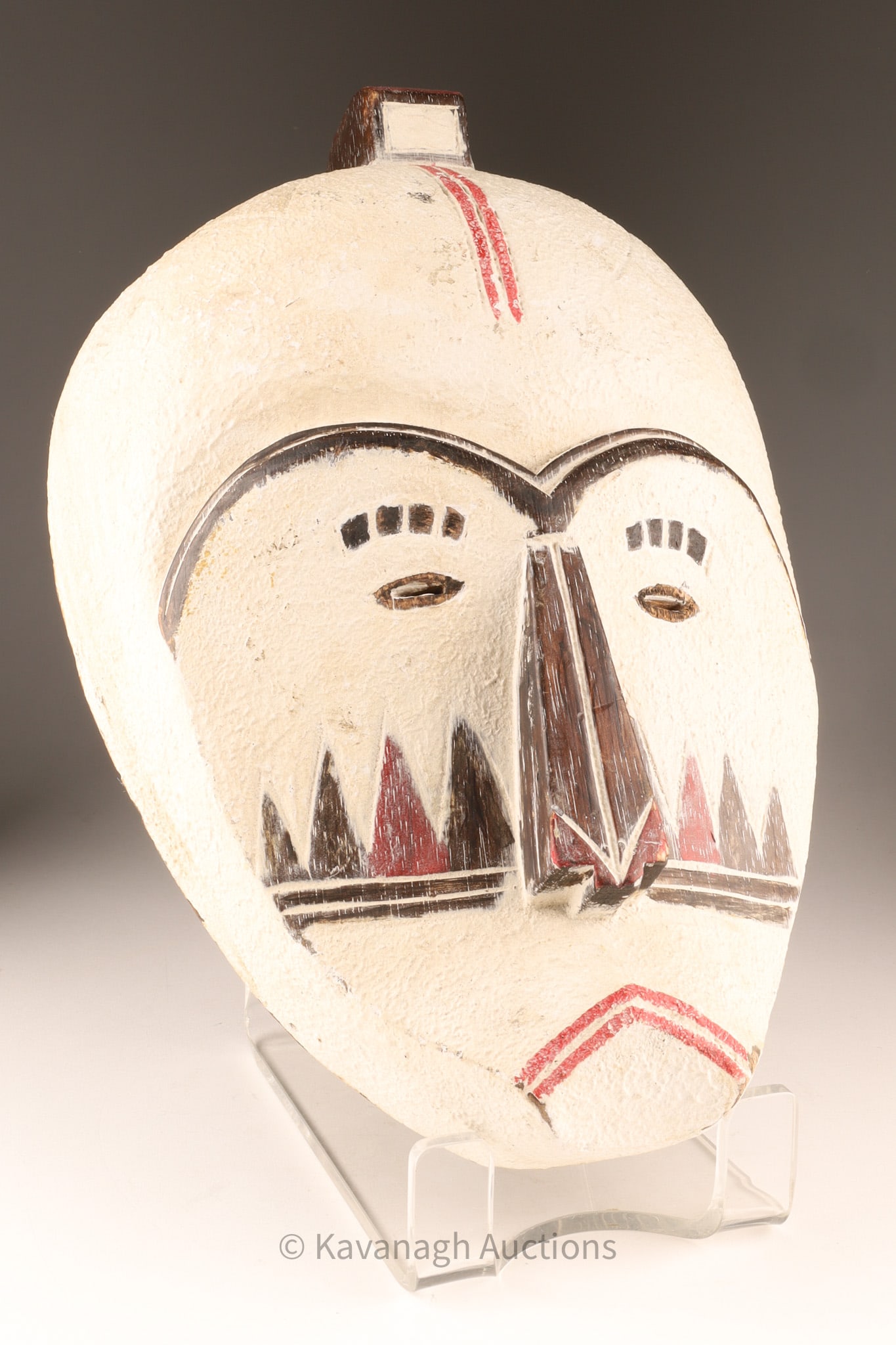 African Fang Style Ngil Mask with Kaolin Pigment, Gabon Style Carved Wood Mask: Carved African Fang-style mask featuring a long, stylized face with narrow eyes, pronounced triangular nose, and geometric painted decoration. The surface is coated with a textured white kaolin-style