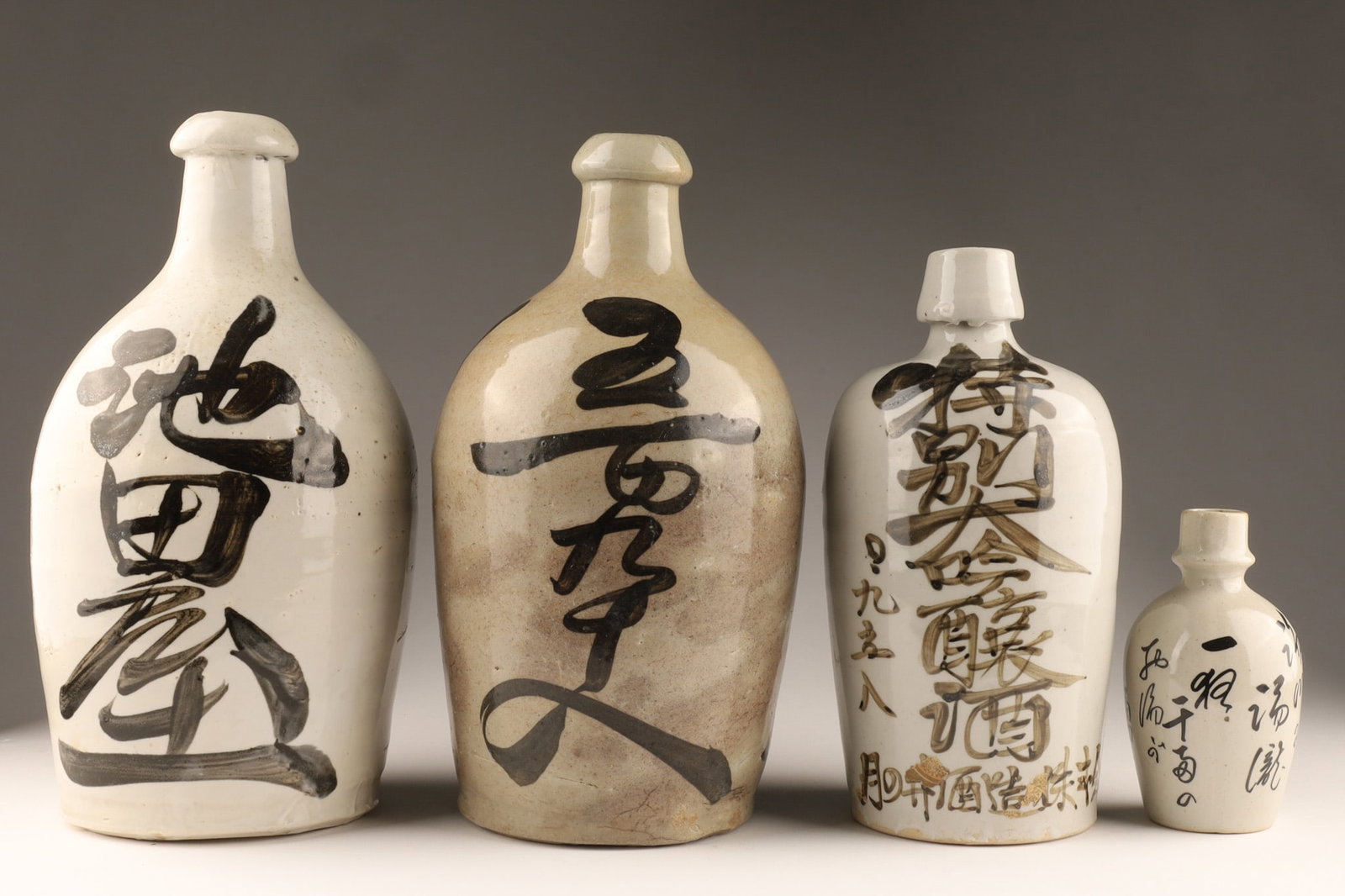 A Collection of Japanese Ceramic Stoneware Tokkuri Sake Bottles (1 of 5)