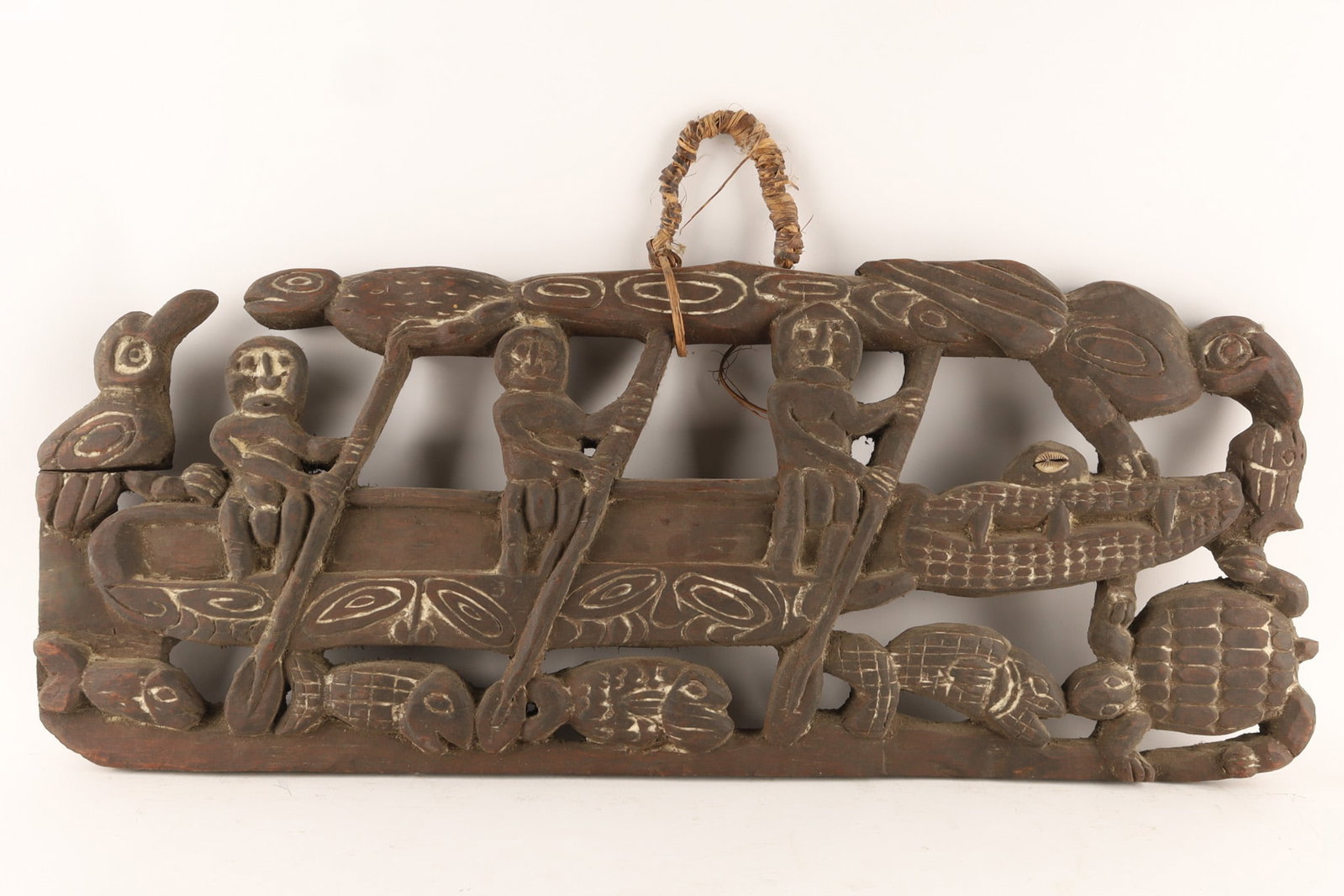 A Kambot storyboard from the Sepik River region of Papua New Guinea: A Kambot storyboard from the Sepik River region of Papua New Guinea depicting scenes from local myths and everyday village life. Narrative Scene: shows people in canoe (with crocodile as canoe p