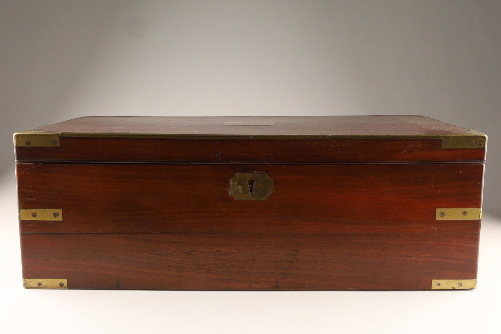 19th C. Georgian Brass Bound Mahogany Writing Slope: Georgian-era mahogany writing slope box, featuring brass corner reinforcements and campaign-style hardware. Function: Designed as a portable desk, it opens to reveal a slanted writing surface, o