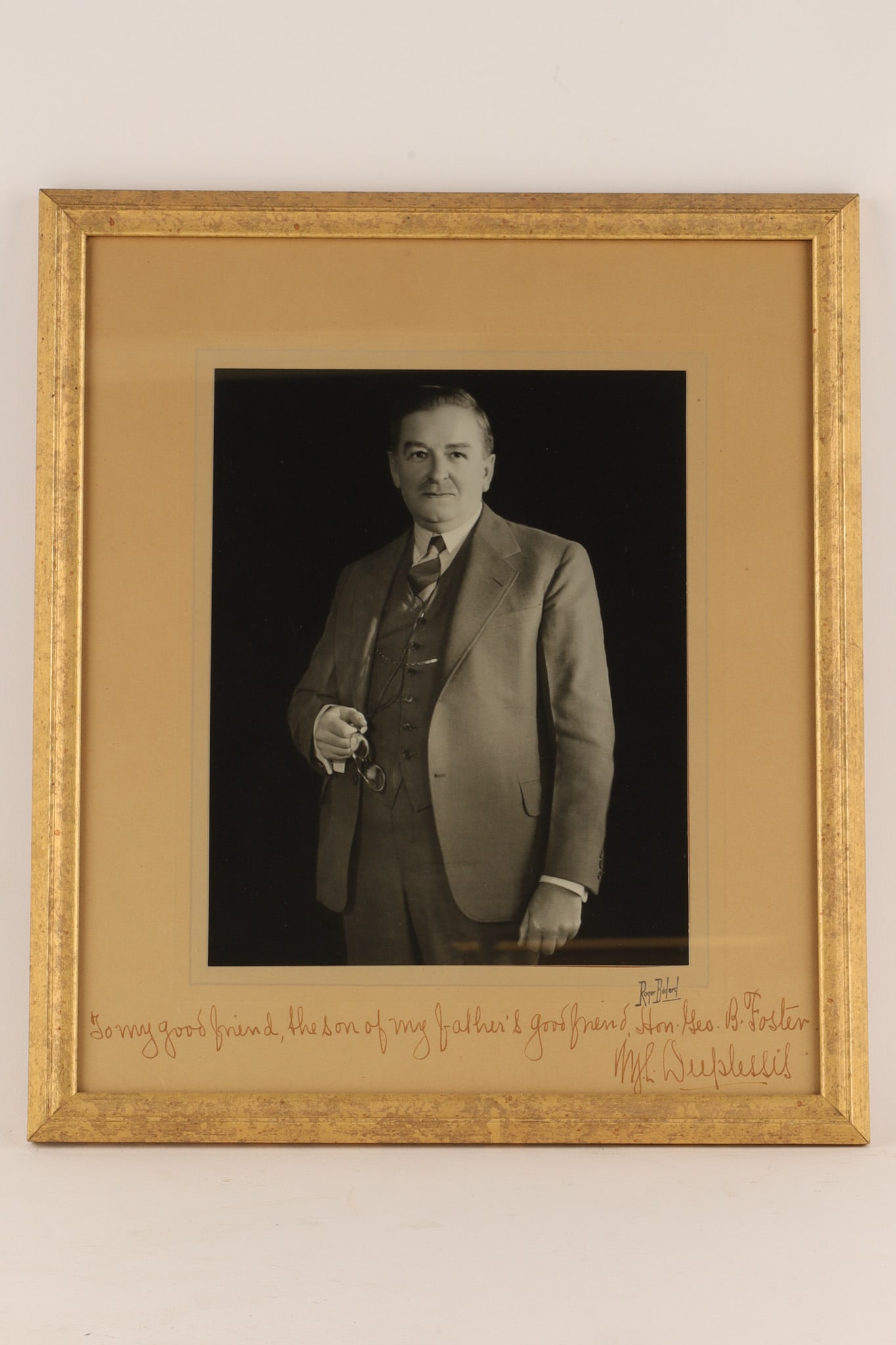 Autographed and Dedicated Photograph of Quebec Premier Maurice Duplessis (1890-1959): Autographed official portrait photograph of Maurice Duplessis, a dominant and controversial figure in Canadian history who served as the 16th Premier of Quebec. A version of this photo was famously di