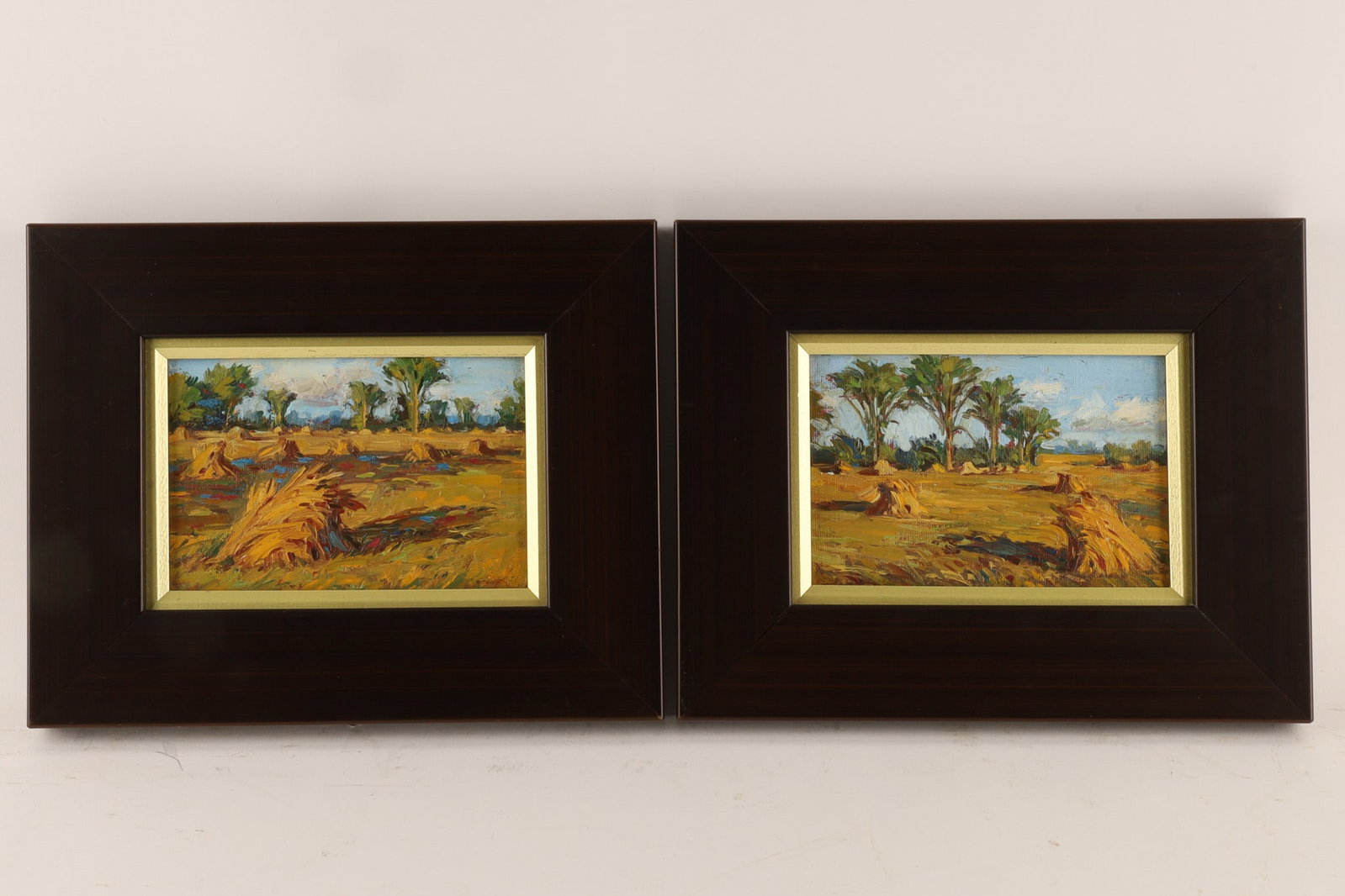 Pair of Douglas Allan Fales (Canadian, 1929-2024) oil on panel, Oat Stacks in Landscape (1 of 6)