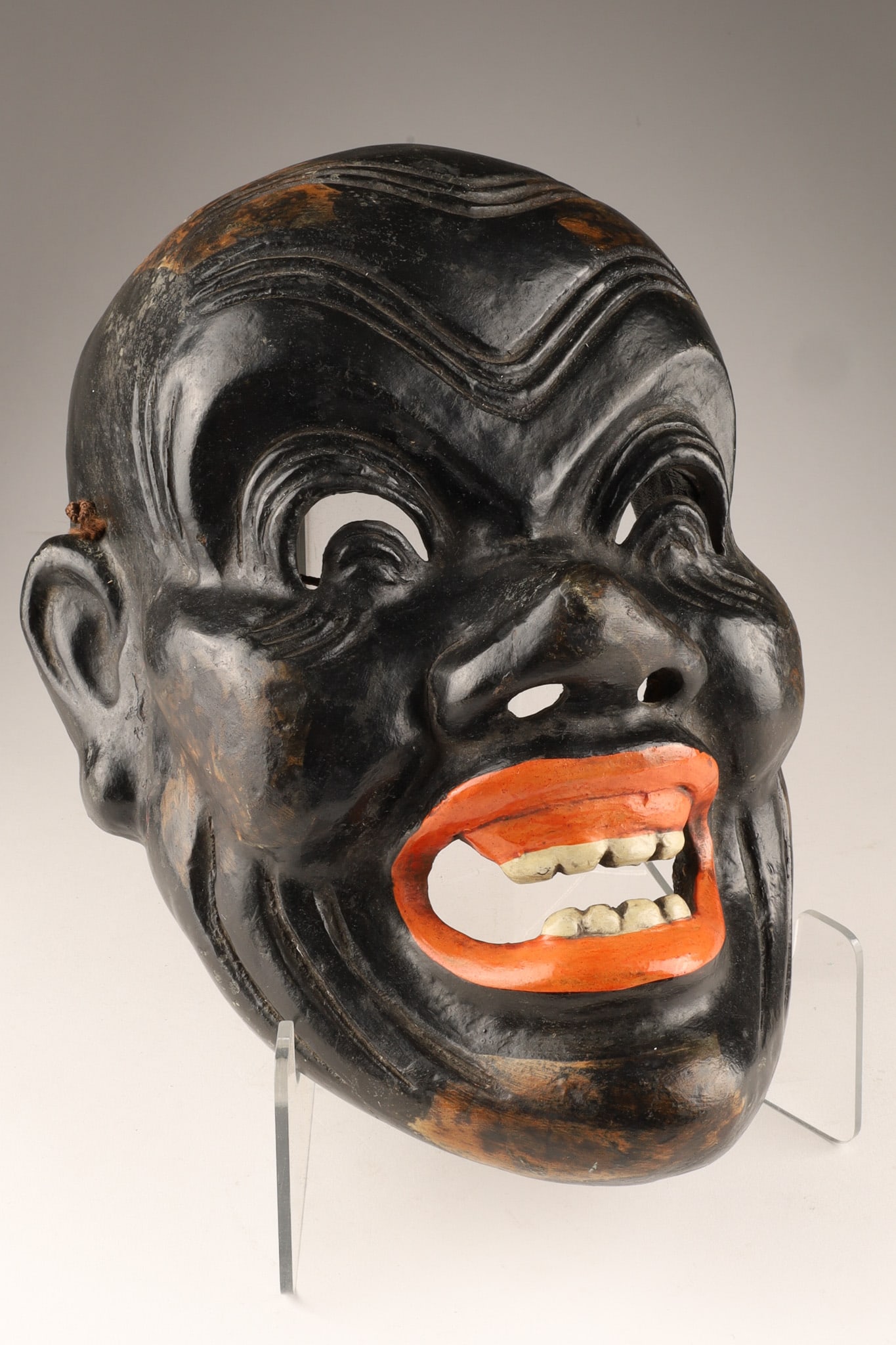 Japanese Meiji Period Noh or Kagura Theater Mask, Black Lacquer: Japanese Meiji Period Noh or Kagura theater mask featuring a dark lacquer or patina finish. Such masks represent various characters, including traditional Kyogen figures like the Otobide (large-featur