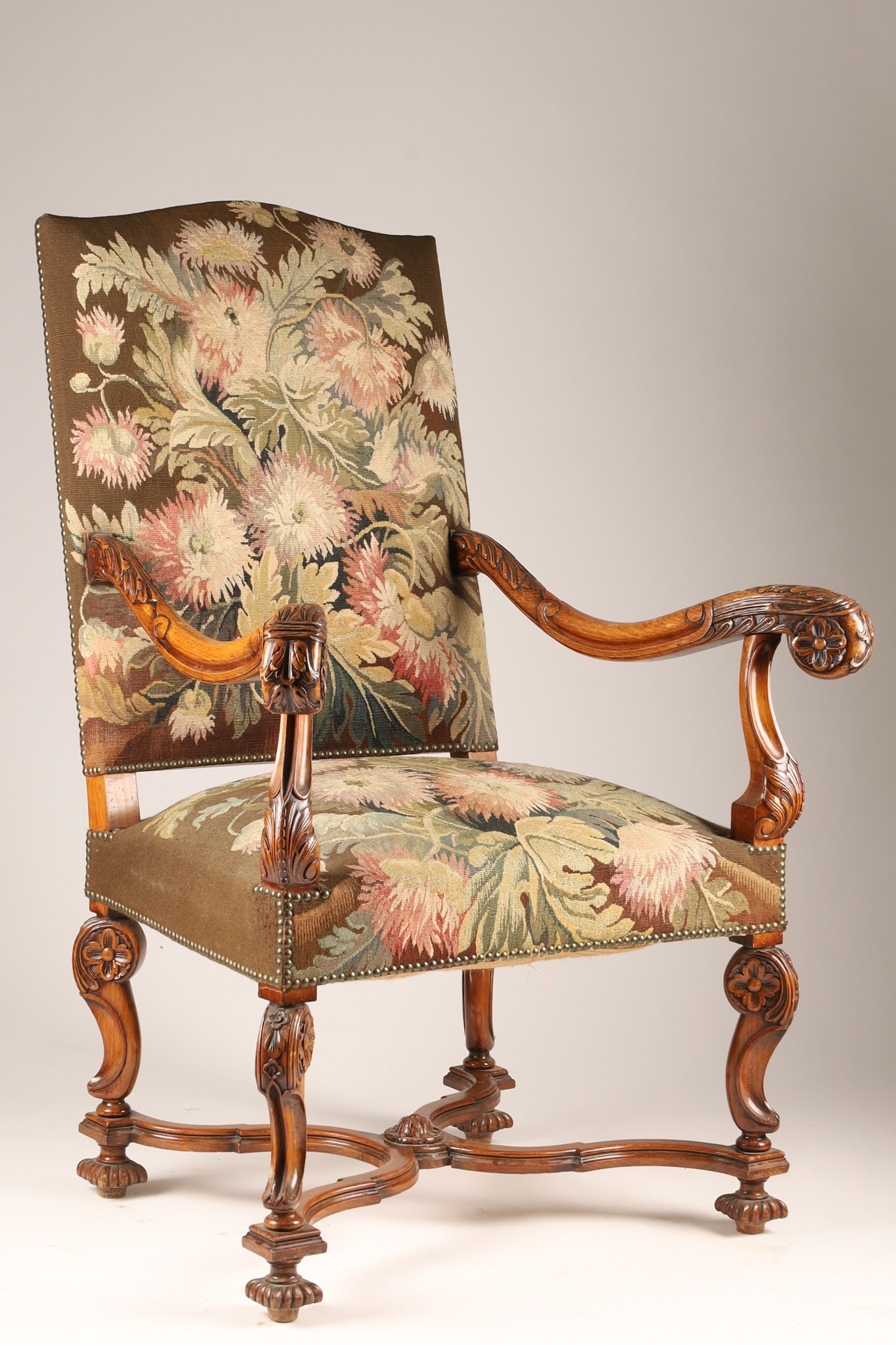 19th C French Louis XIII Style High-back Throne Armchair, Floral Tapestry Upholstery: A Louis XIII style high-back throne armchair, likely dating from the late 19th or early 20th century. Carved walnut with tall, straight back and ornate carvings on scrolled armrests and a distinctive 