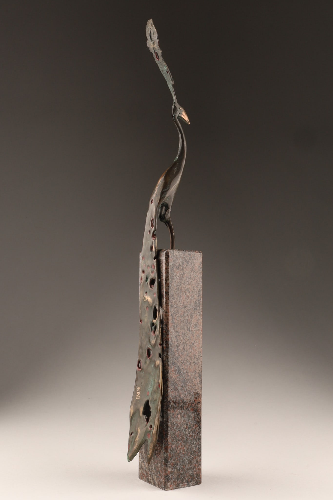 Igor Kitzberger (Czechia, 1963 - 2025) Peacock Bronze Marble Sculpture: Igor Kitzberger (Czechia, 1963 - 2025) bronze sculpture of a peacock mounted on a square tall red and grey marble plinth base, with red painted highlights on the curved tail, signed on the tail Gor Ki