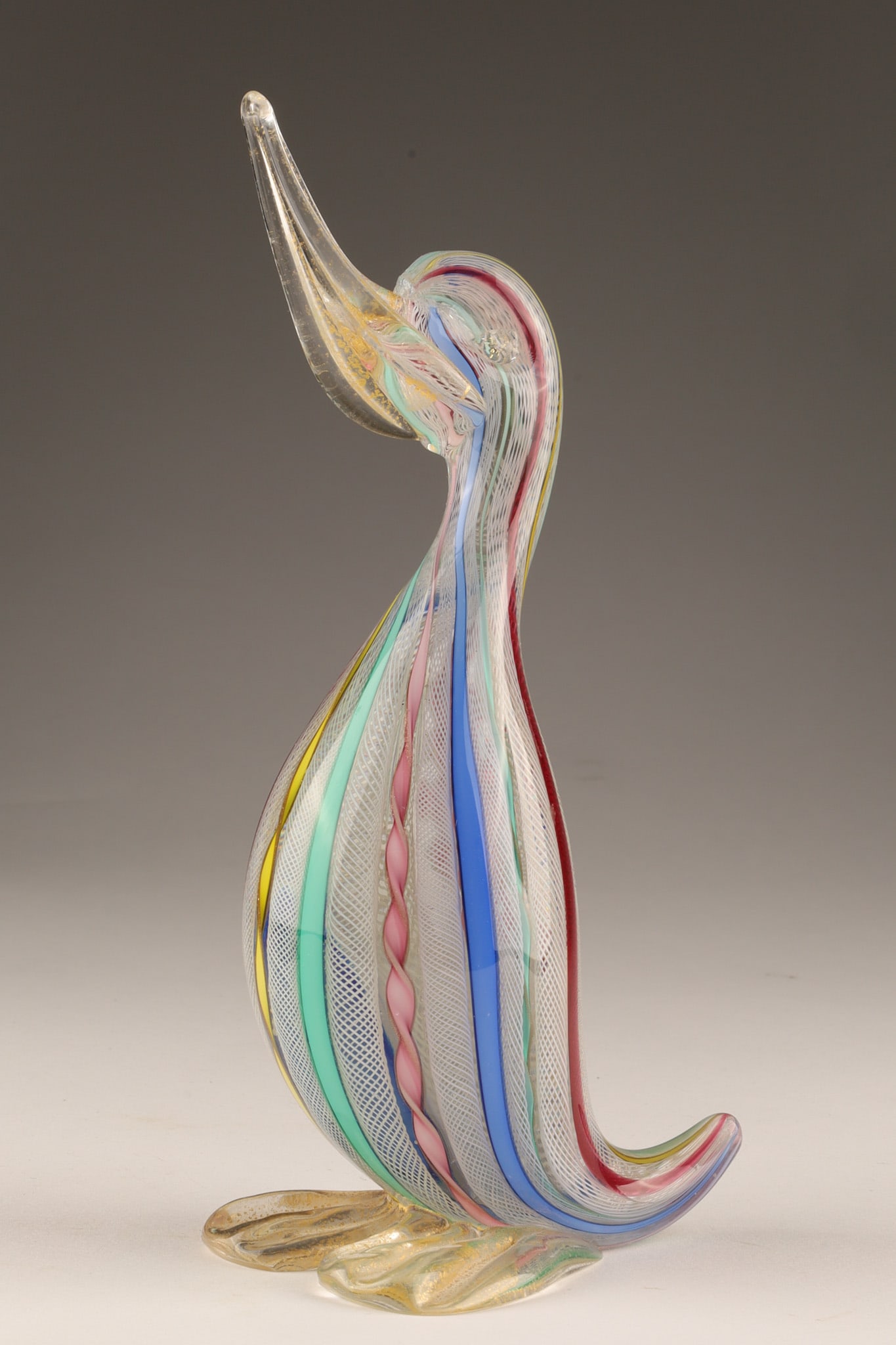 Mid Century A.ve.m. Murano Italy 1950s Zanfirico Duck Figurine: A Murano glass duck, a mid-century Italian piece from the 1950s produced using the zanfirico (also known as filigrana a retortoli) technique, which involves stretching and twisting fine filigree canes