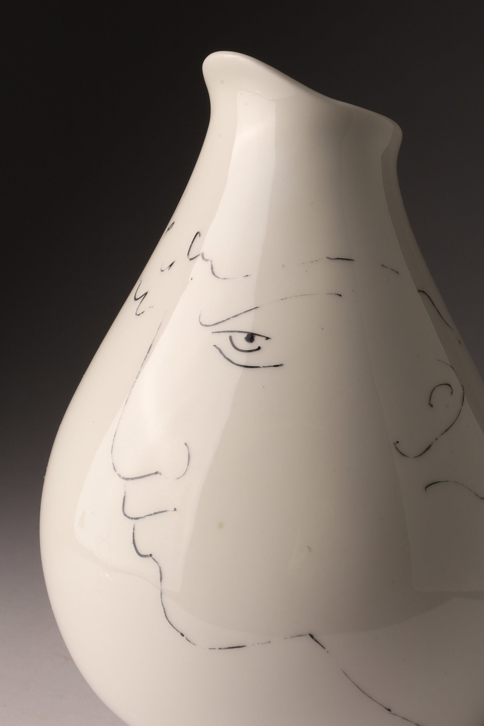 Jean Cocteau Porcelain Vase, model Tete / Head designed for Rosenthal: Jean Cocteau Porcelain Vase, model Tete / Head designed for Rosenthal. The use of irregular shapes and minimalist facial motifs is characteristic of Cocteau's work. Marked on underside, Rosenthal Germ