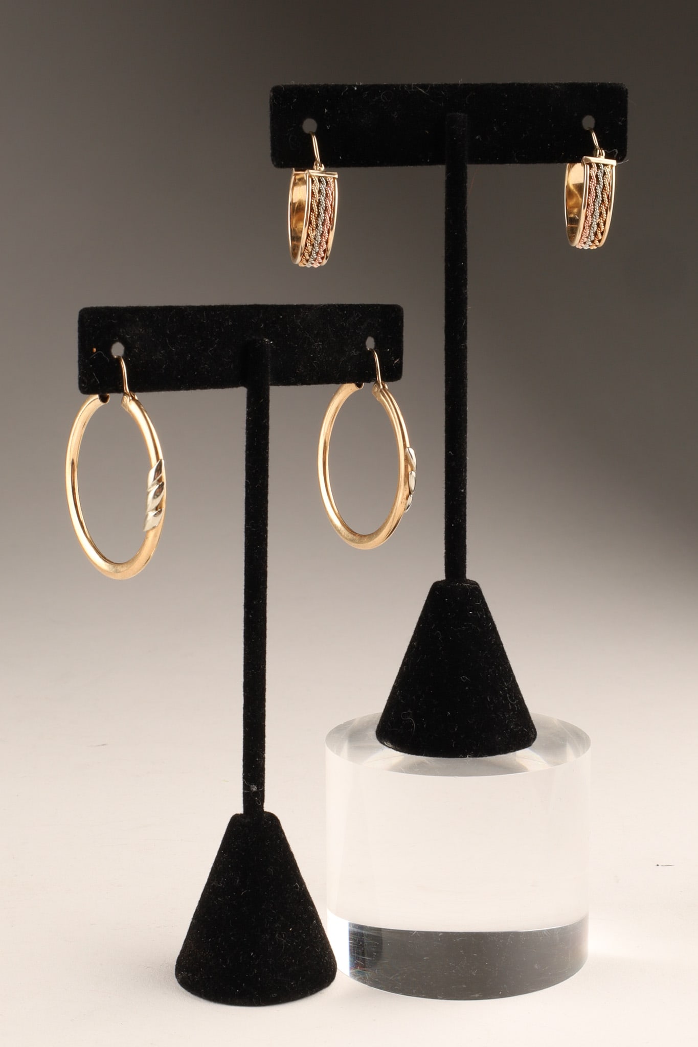 Two Pairs of 10K Gold Mixed Metal Hoop Earrings: Two Pairs of 10K Gold Mixed Metal Hoop Earrings, one tri-colour set of hoops with 10K marking on post, the other 10K ellow Gold with applied silver detail with 10K marking on post . Total weight