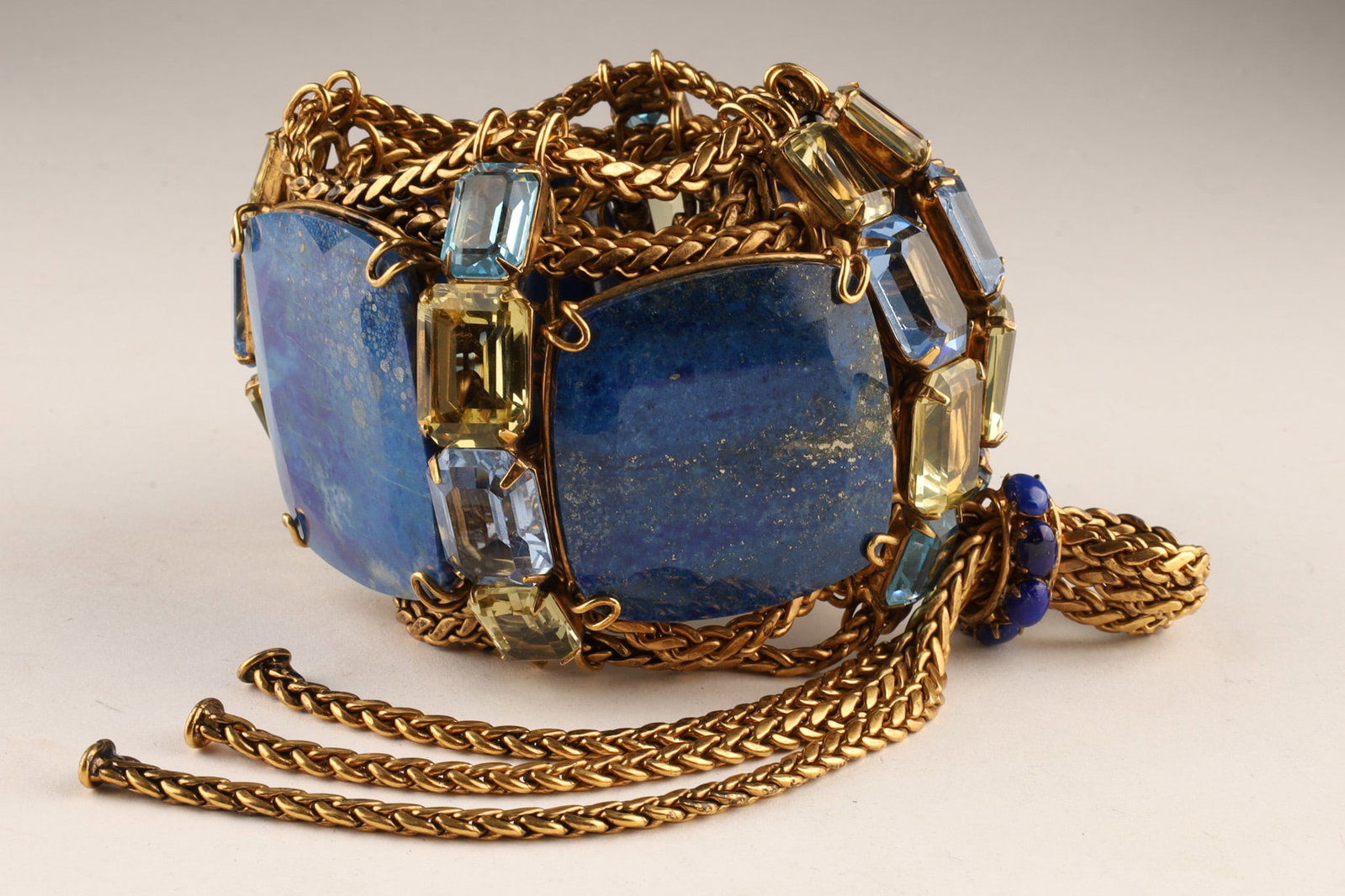 Iradj Moini Lapis Lazuli and Citrine Bracelet: Statement bracelet designed by Iradj Moini festuring three large, vibrant blue lapis lazuli tablets which form the structure of the bracelet, contrasted by lighter citrine and light blue crystal accen