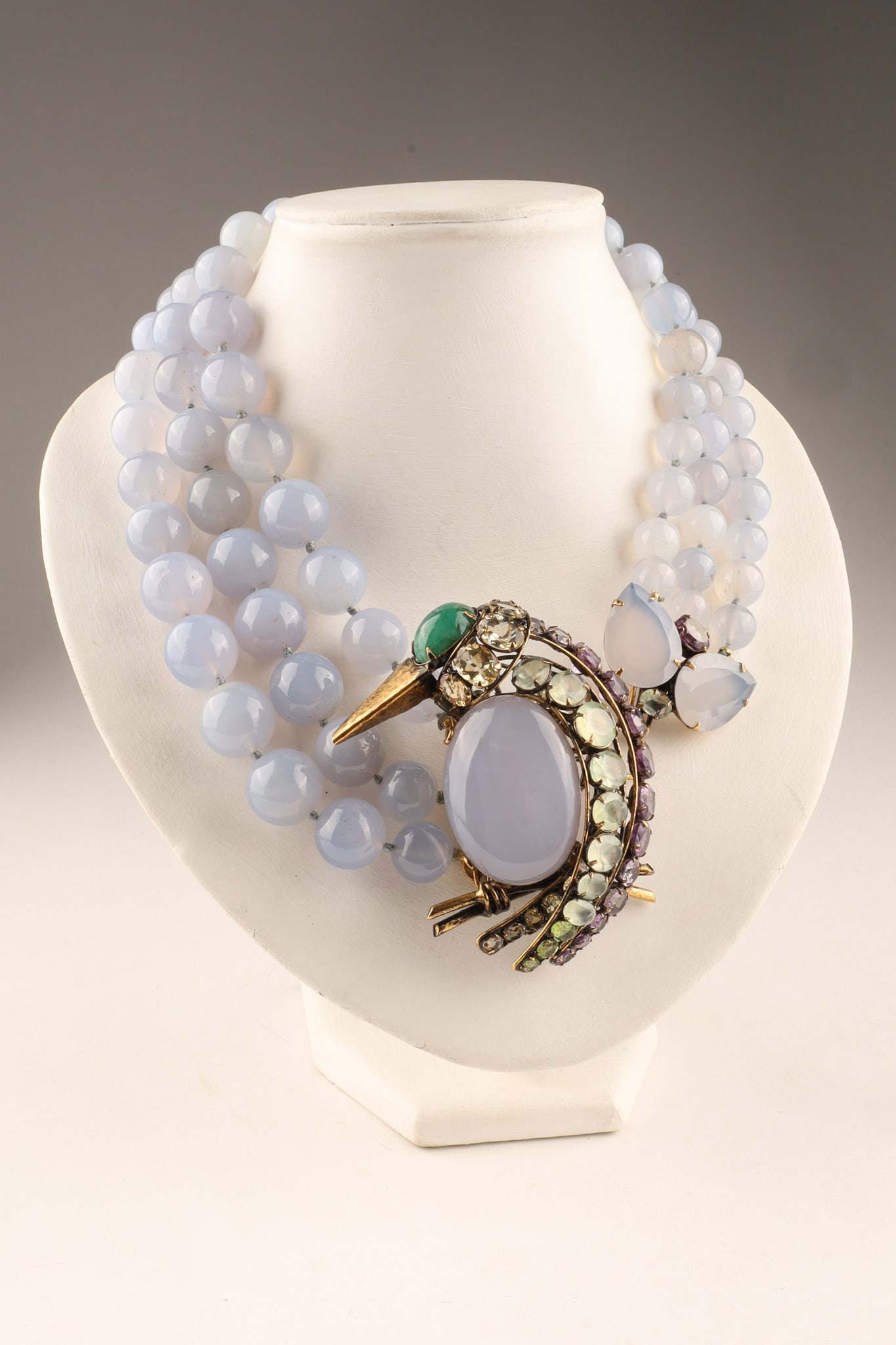 Iradj Moini Quartz Three Strand Chalcedony Necklace with Bird Pendant: Iradj Moini Quartz Three Strand Necklace featuring multiple rows of smooth, blue chalcedony quartz beads with a massive, beautifully sculpted figural bird brooch forms the focal point. The bird's body