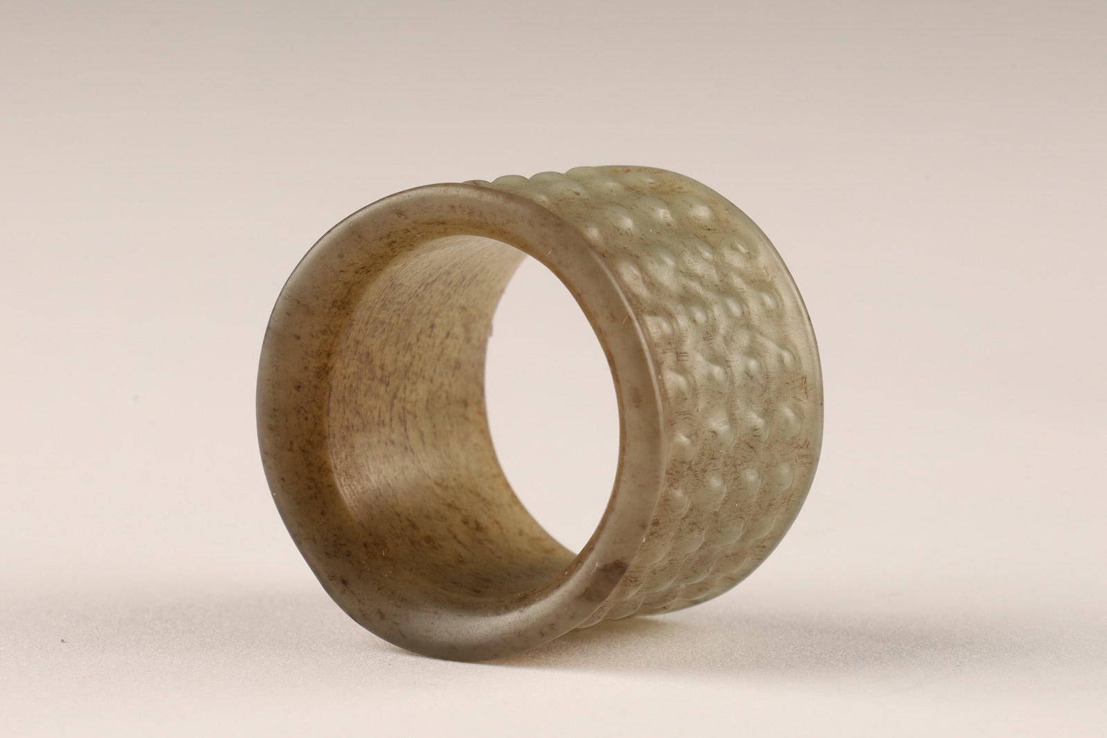 Chinese Jade Archer's Thumb Ring: Chinese Jade Archer's Thumb Ring, raised bump or pimple design pattern. Measuring 1.25 inches W x 0.75 H.