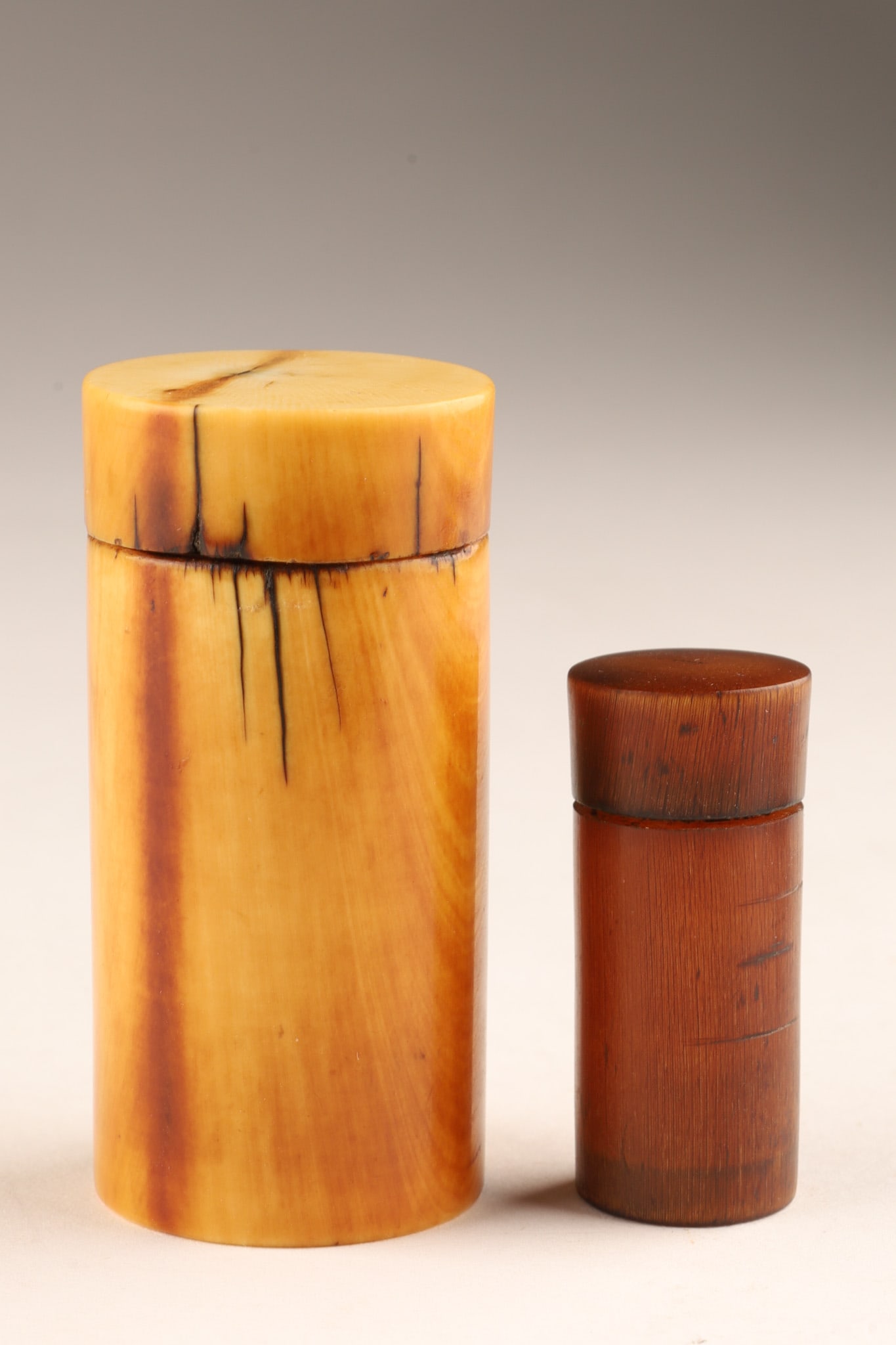Lot of Two Antique Chinese Opium or Cylinder Boxes: Lot of Two Antique Chinese Opium or Cylinder Boxes. One measures 1.75 inches H, the other 2.5 inches. PLEASE NOTE: THIS LOT CANNOT BE EXPORTED FROM CANADA.