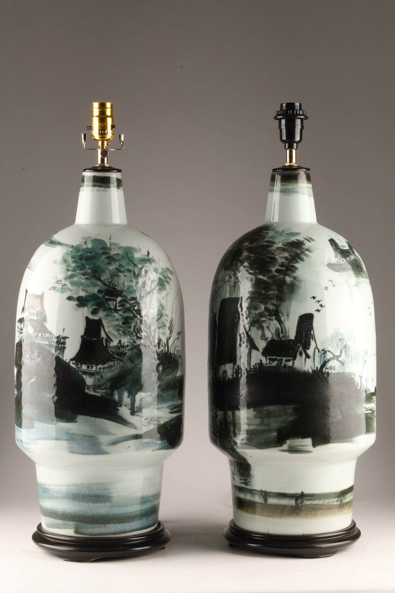 Pair Large Chinese Hand Painted Shan Shui Ink Wash Bottle Vase Lamps: A pair of large Chinese porcelain table lamps featuring traditional hand-painted monochrome ink-wash brushwork. The matching bottle-form ceramic bodies depict fluid mountainous landscape scenes with d