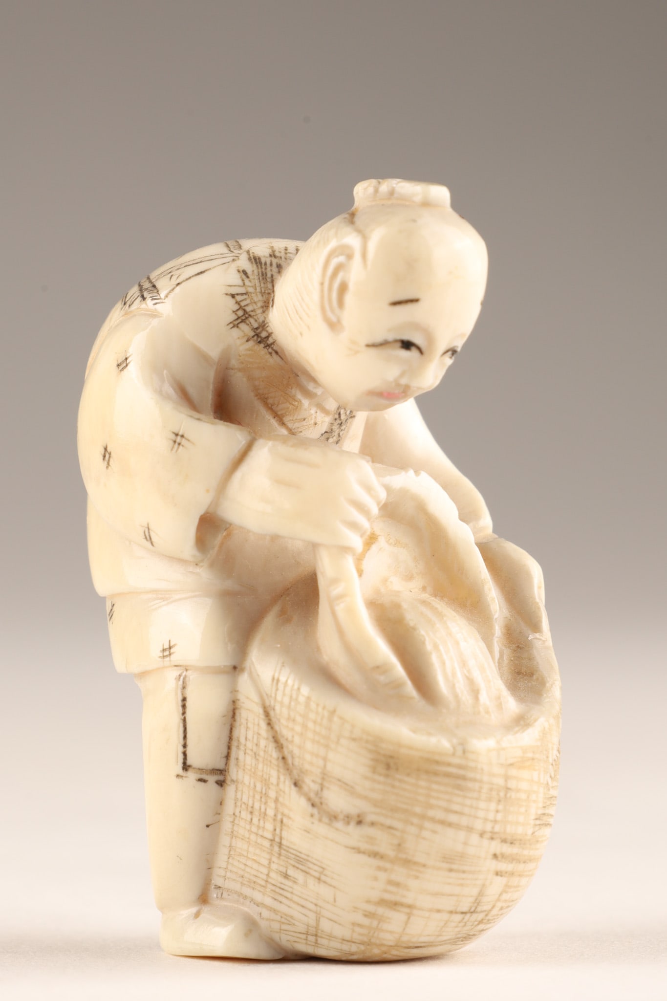 Signed Japanese Carved Netsuke Figure of a Man with Basket (1 of 5)
