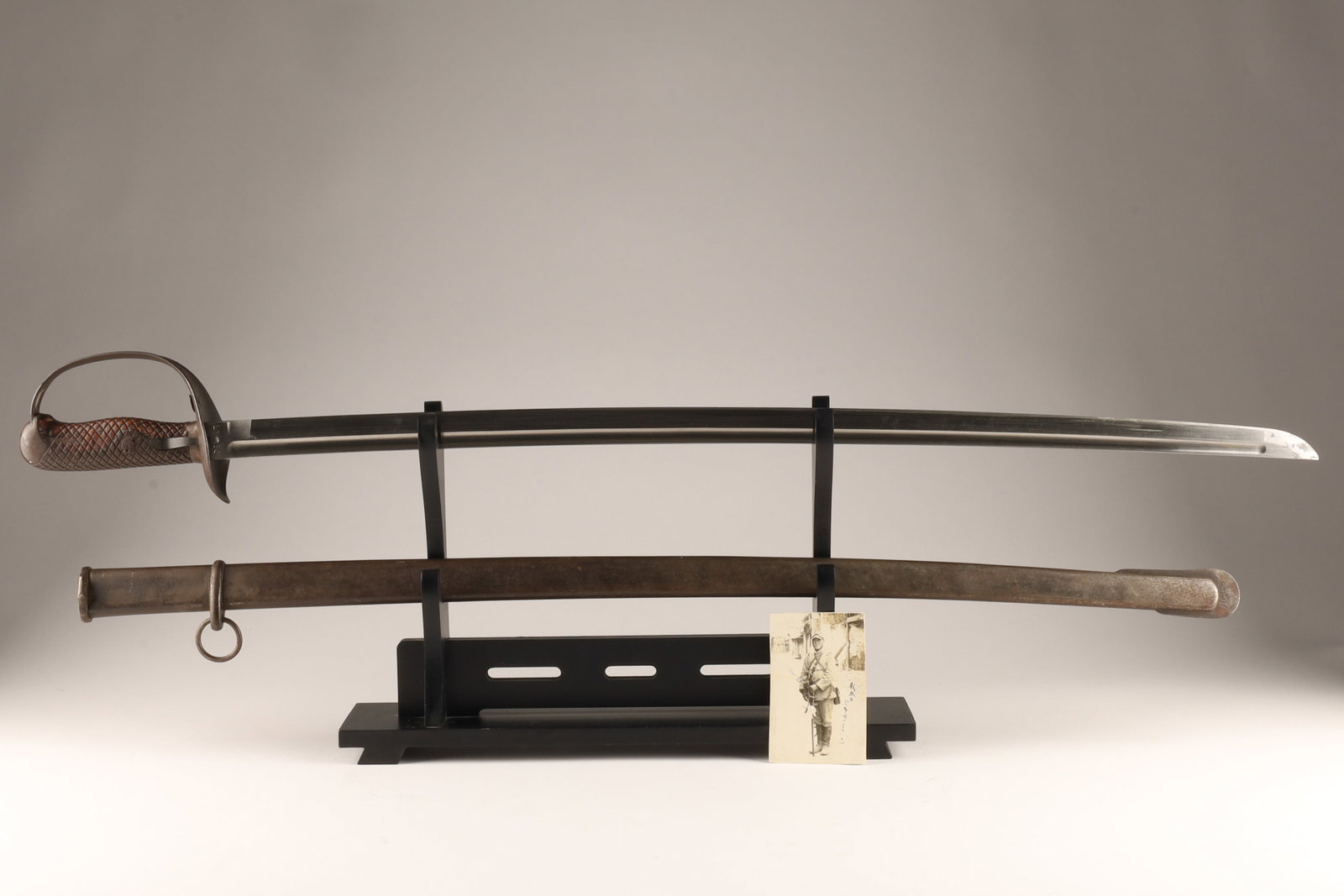 The Type 32 Japanese Sword (Sanjuni-nen-shiki gunto): This sword is a standardized military saber introduced by the Imperial Japanese Army in 1889. Heavily influenced by European cavalry sabers, it featured a Western-style, single-hand hilt combined